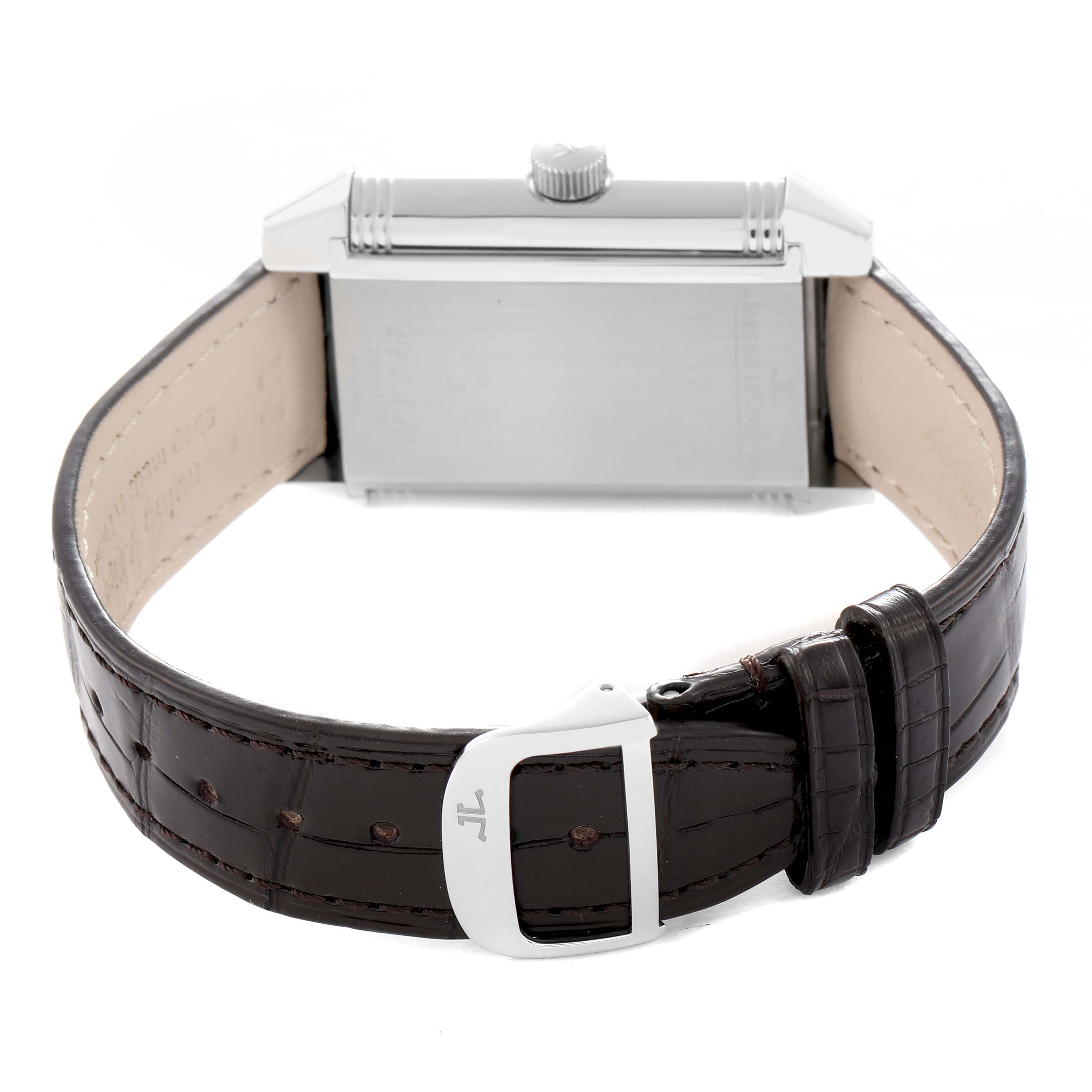 The image shows the Jaeger-LeCoultre Reverso model from a rear angle, highlighting the case back, crown, and leather strap with clasp.