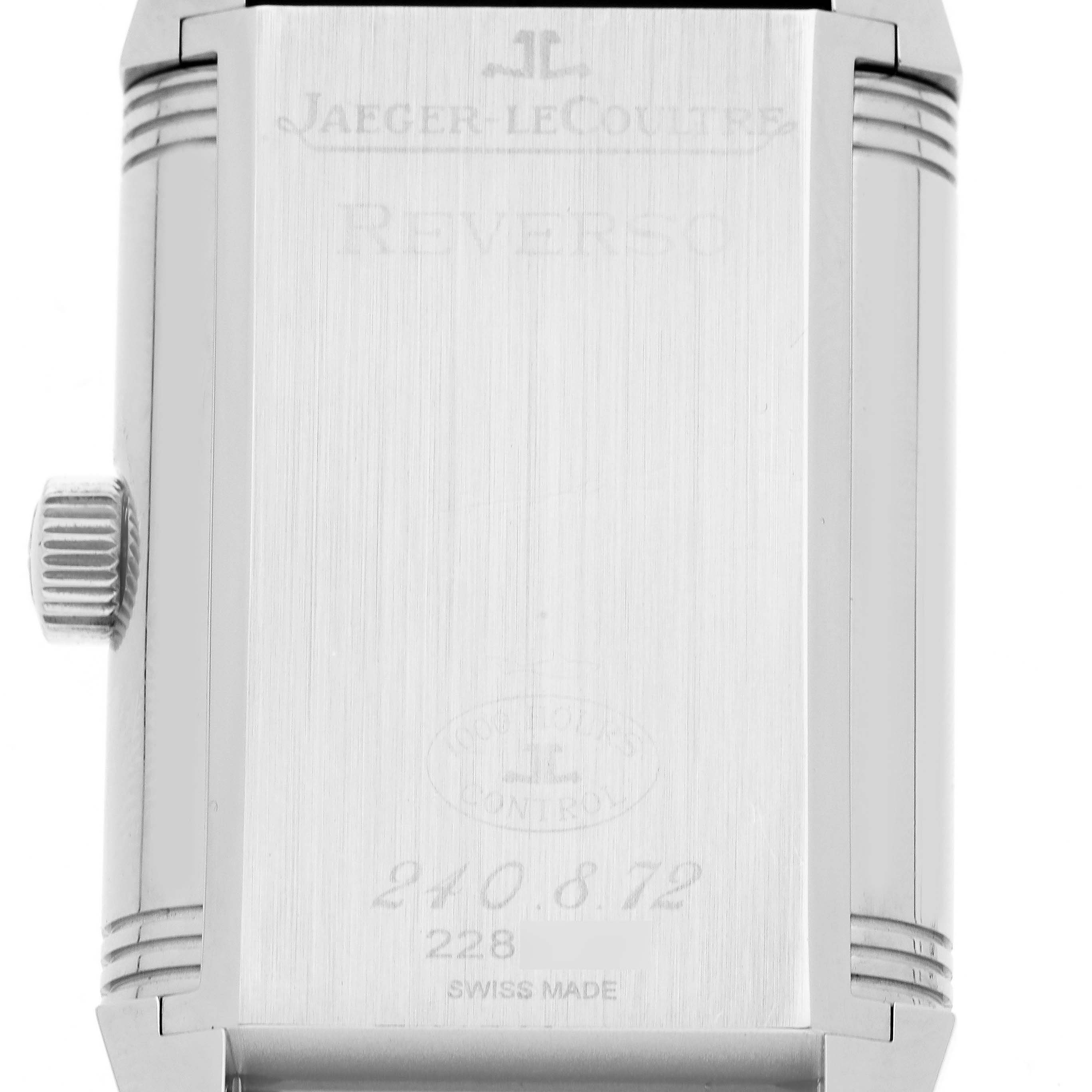 The image shows the back case of a Jaeger LeCoultre Reverso Q3038420 Men
s Stainless Steel Silver Dial, highlighting its engraved details and crown.