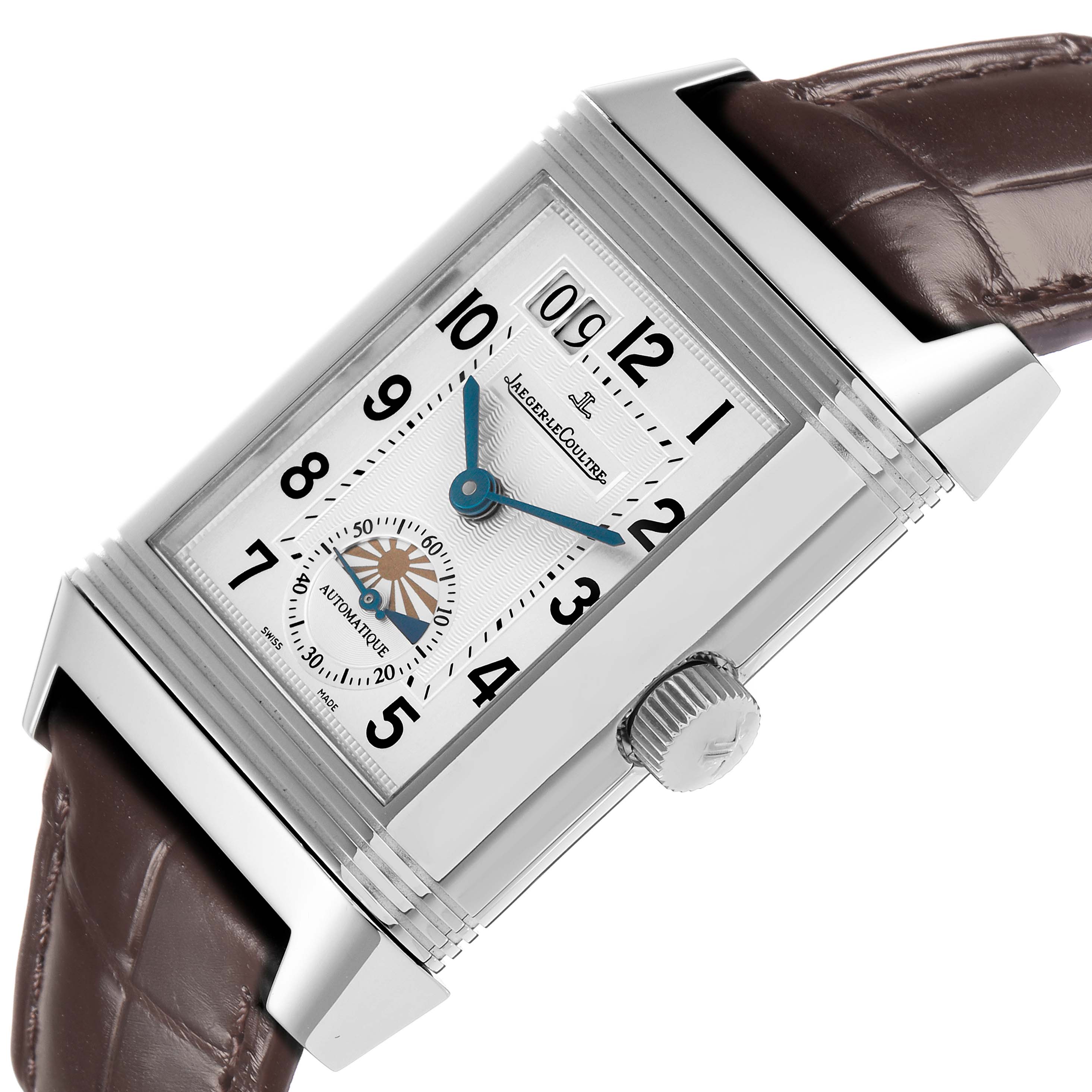 The Jaeger-LeCoultre Reverso watch is shown at an angle, displaying its face, dial, and crown with a leather strap.