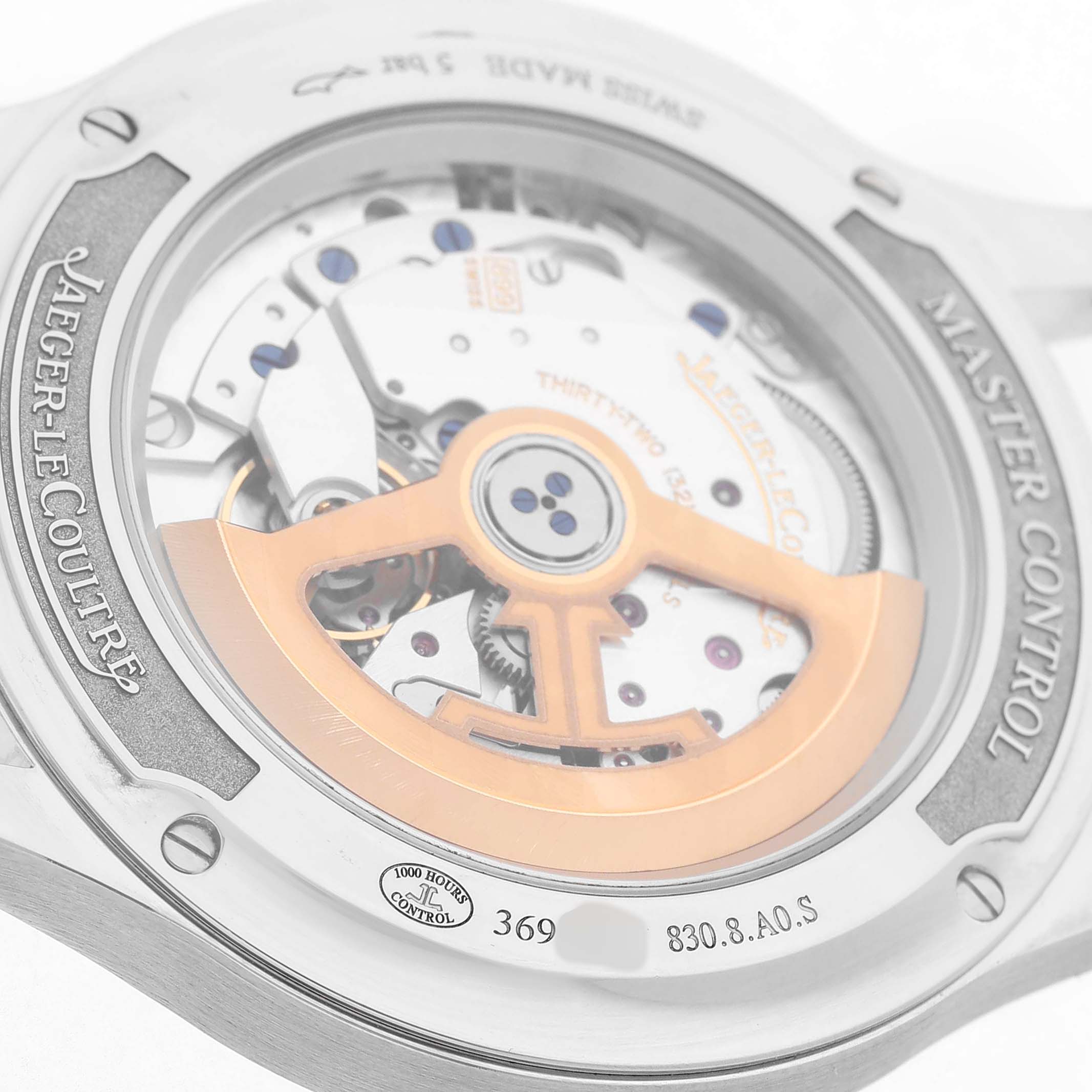 The image shows the back view of a Jaeger LeCoultre Master Q4018420 Men's Stainless Steel Silver Dial model, highlighting its mechanical movement and rotor.