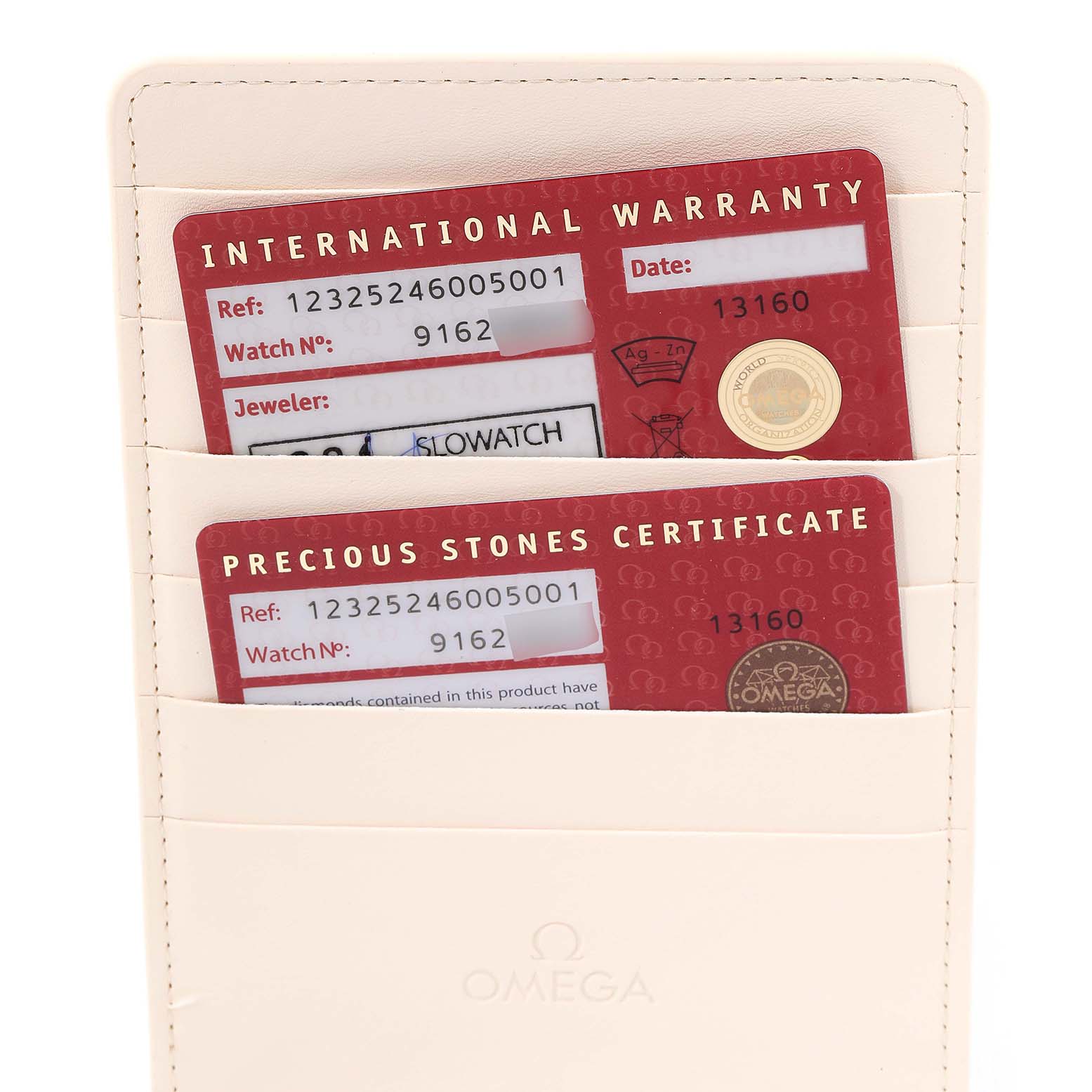 This image shows the international warranty and precious stones certificate cards for the Omega 123.25.24.60.05.001 Women's Steel and Gold (two tone) Mother of Pearl Dial 123.25.24.60.05.001 Women's Steel and Gold (two tone) Mother of Pearl Dial Constellation Star Steel Yellow Gold Diamond Ladies Watch 123.25.24.60.05.001.