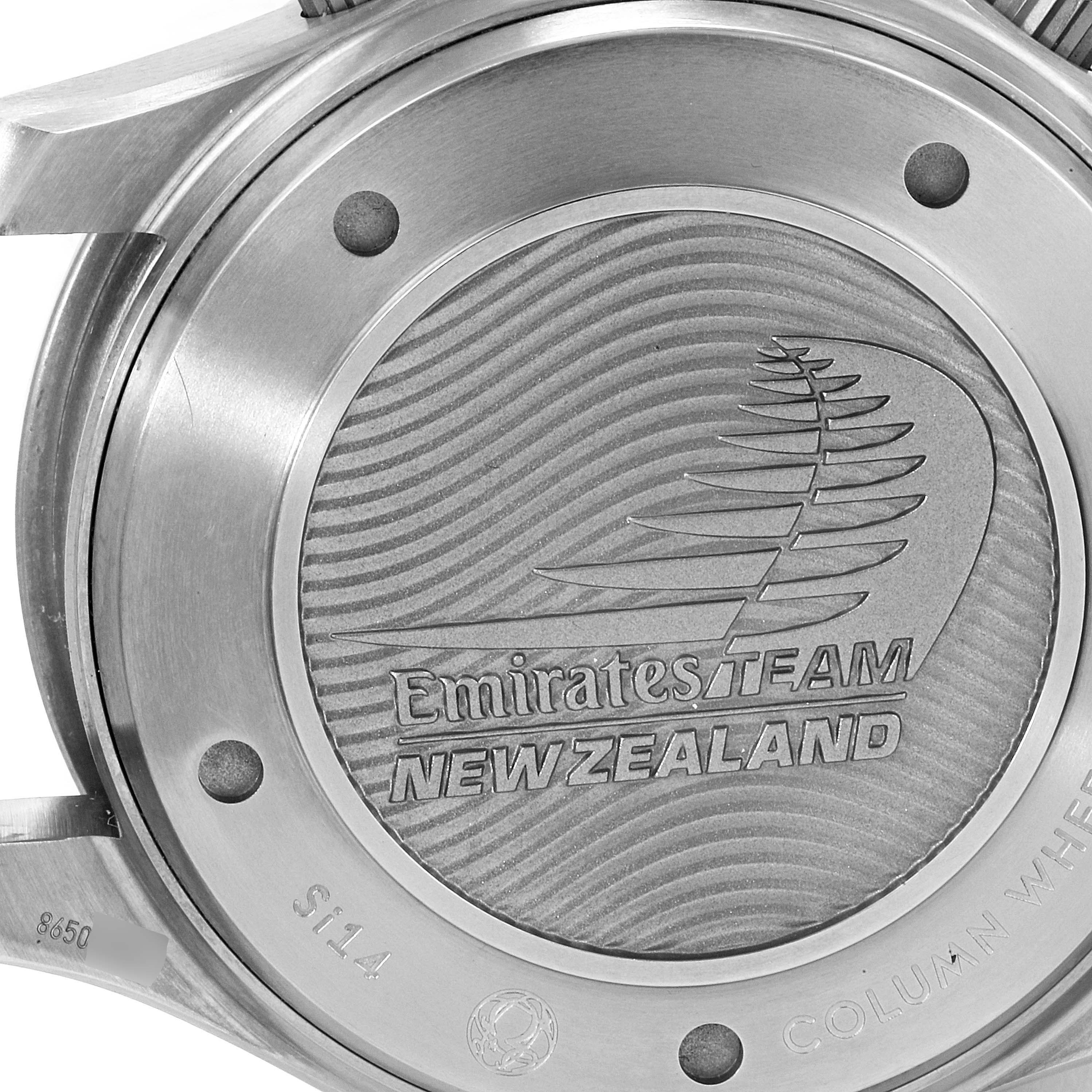 The image shows the case back of the Omega Seamaster 212.92.44.50.99.001 Men's Titanium Grey Dial 212.92.44.50.99.001 Men's Titanium Grey Dial watch, featuring the Emirates Team New Zealand engraving.