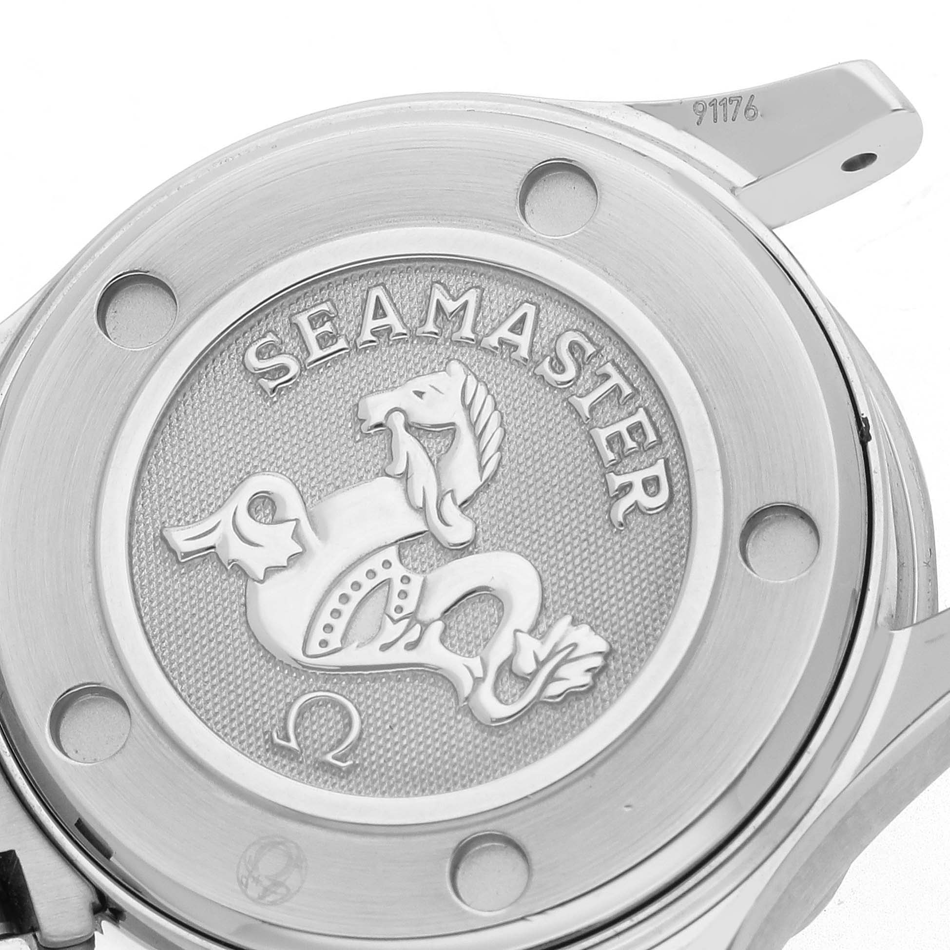 The image shows the case back of the Omega 2224.80.00 Women
s Stainless Steel Blue Dial Seamaster Diver 300M, featuring engravings and the iconic seahorse emblem.