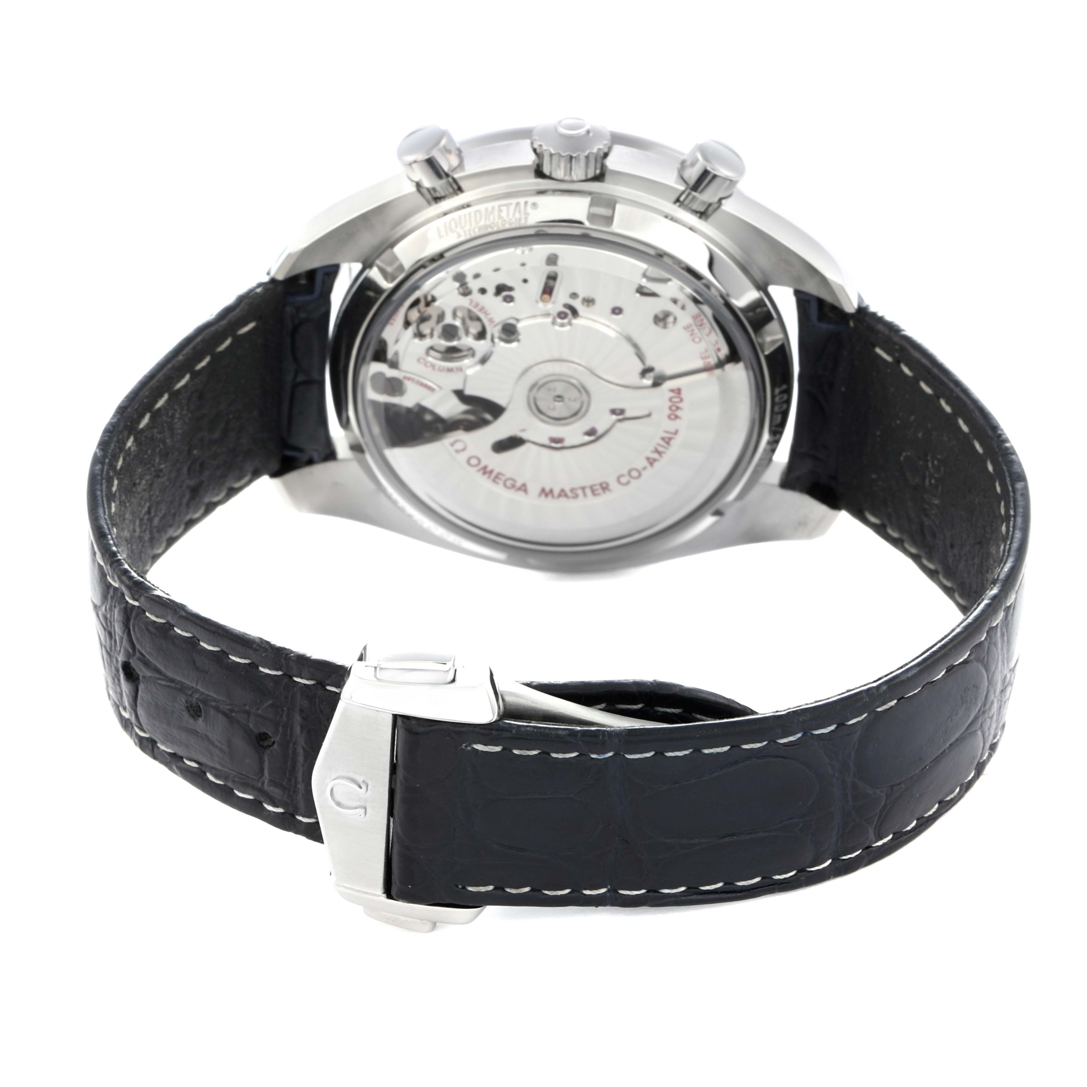 The Omega Speedmaster 304.33.44.52.03.001 Men
s Stainless Steel Blue Dial watch is shown from the back, highlighting the transparent case back and leather strap with clasp.