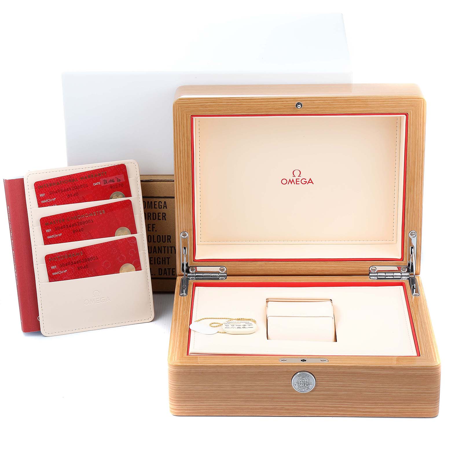 This image shows the packaging, warranty cards, and an empty display box for an Omega Speedmaster 304.93.44.52.03.001 Men's Ceramic Blue Dial 304.93.44.52.03.001 Men's Ceramic Blue Dial watch from the top angle.