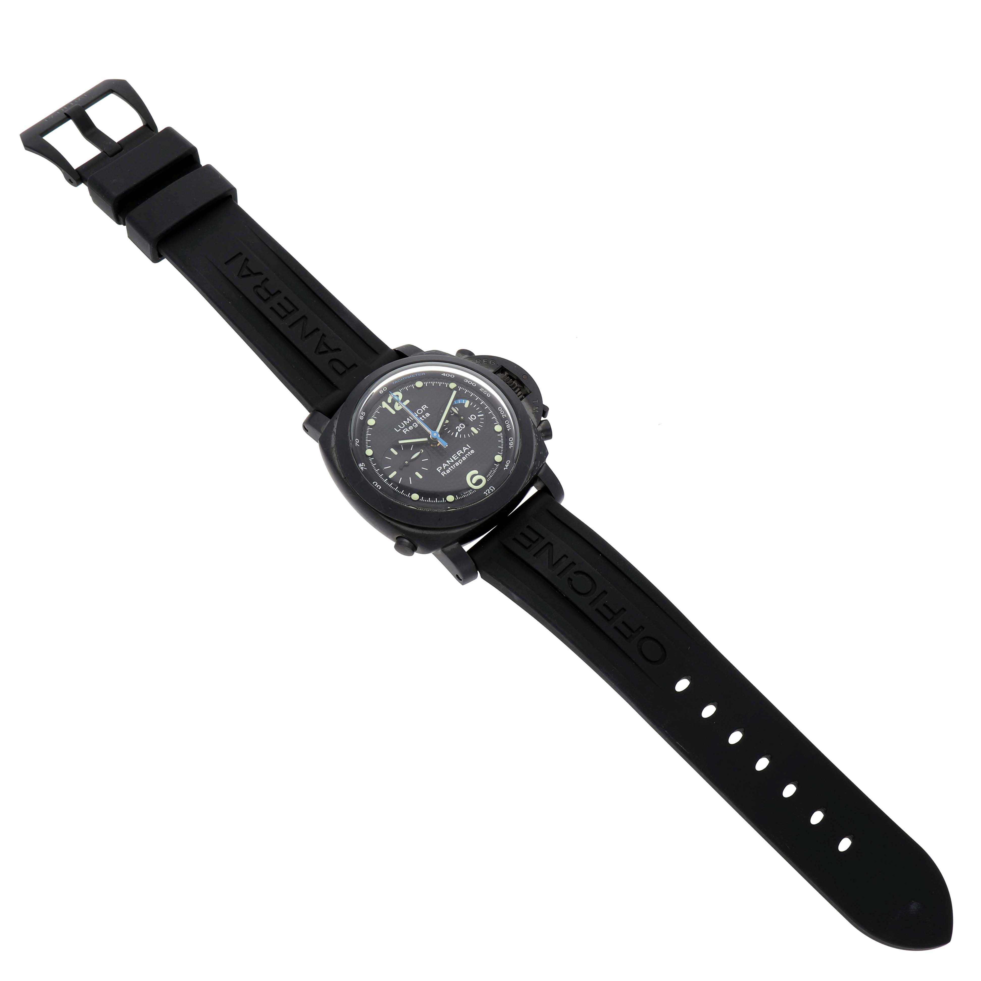 The image shows a Panerai Luminor PAM00332 Men's Stainless Steel Black Dial watch from a top-down angle, highlighting its face, rubber strap, and buckle.