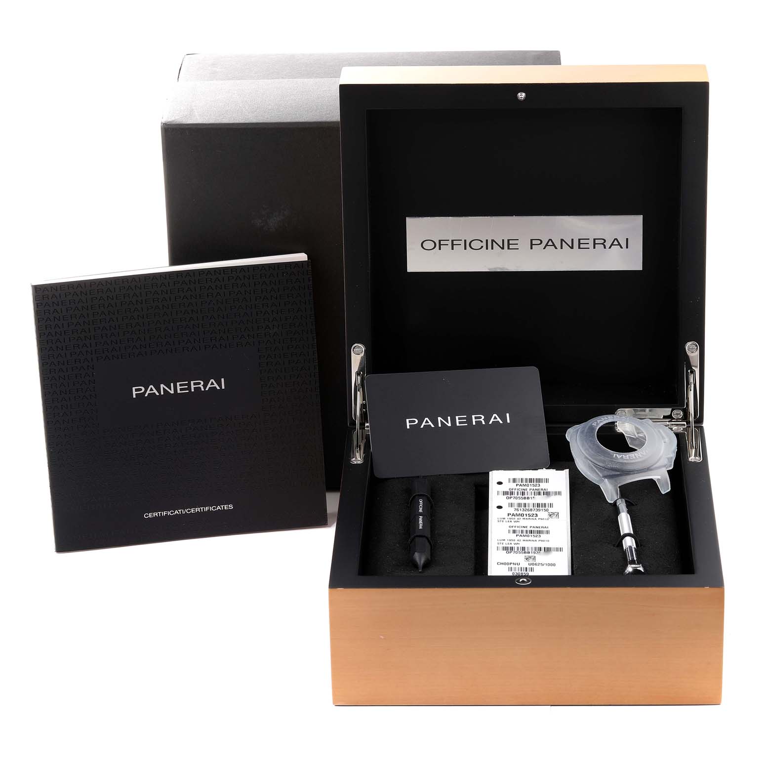 This image shows a Panerai Luminor PAM01523 Men's Stainless Steel White Dial PAM01523 Men's Stainless Steel White Dial watch box containing the manual, tools, and certification inside a black and wooden case.