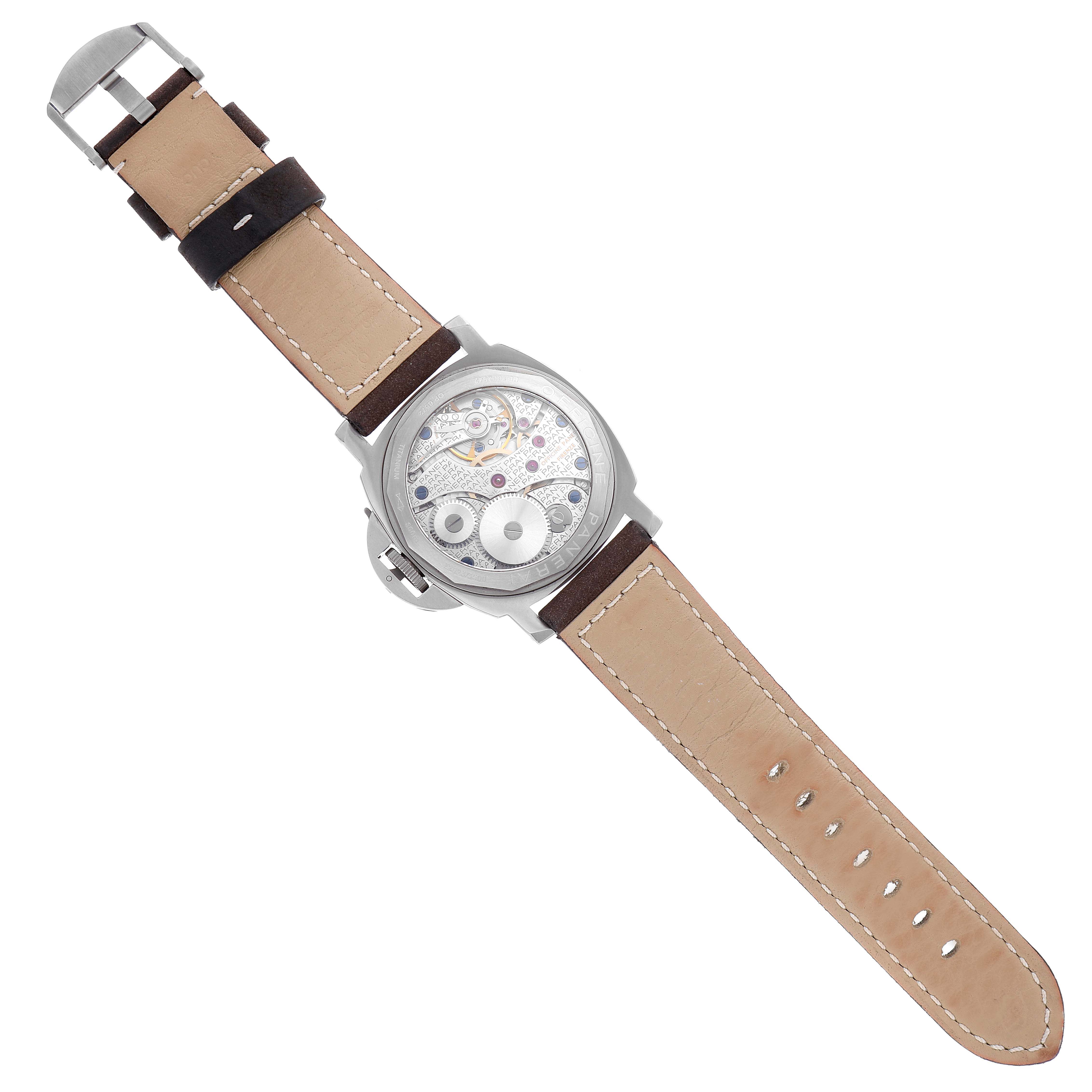 The image shows the back view of the Panerai Luminor PAM00118 Men's Titanium Brown Dial PAM00118 Men's Titanium Brown Dial watch, revealing the internal mechanical components and leather strap.