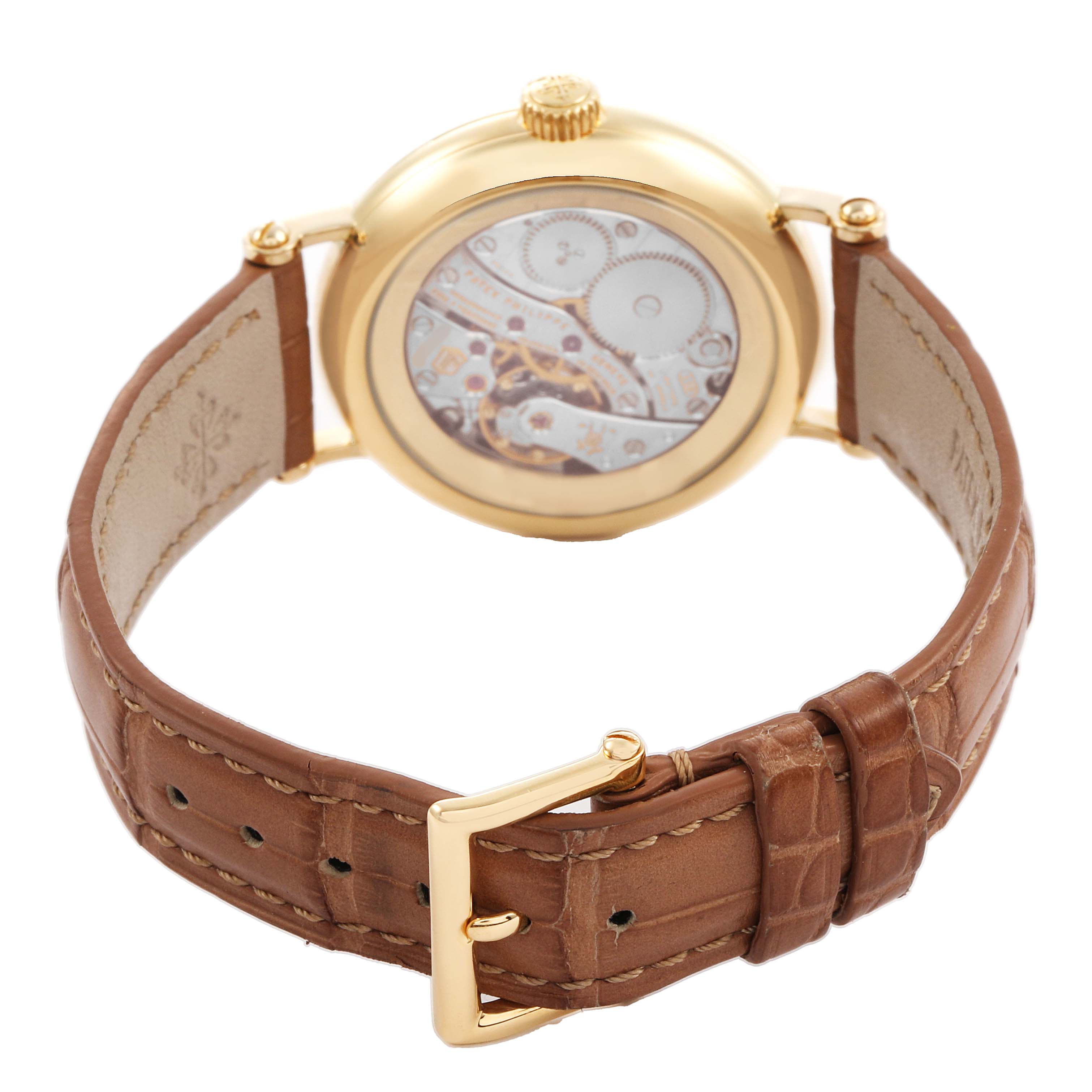 The image shows the back view of a Patek Philippe Calatrava 7121J-001 Women's Yellow Gold Silver Dial, highlighting the movement through the transparent case back and the leather strap.