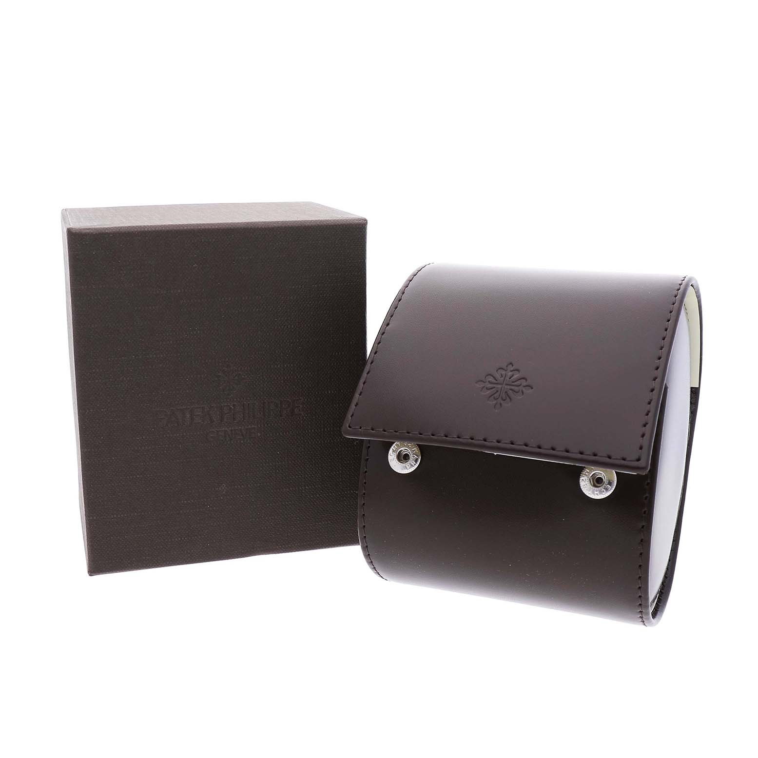 The image shows a Calatrava model watch case by Patek Philippe, with a box and a leather pouch viewed from the front.