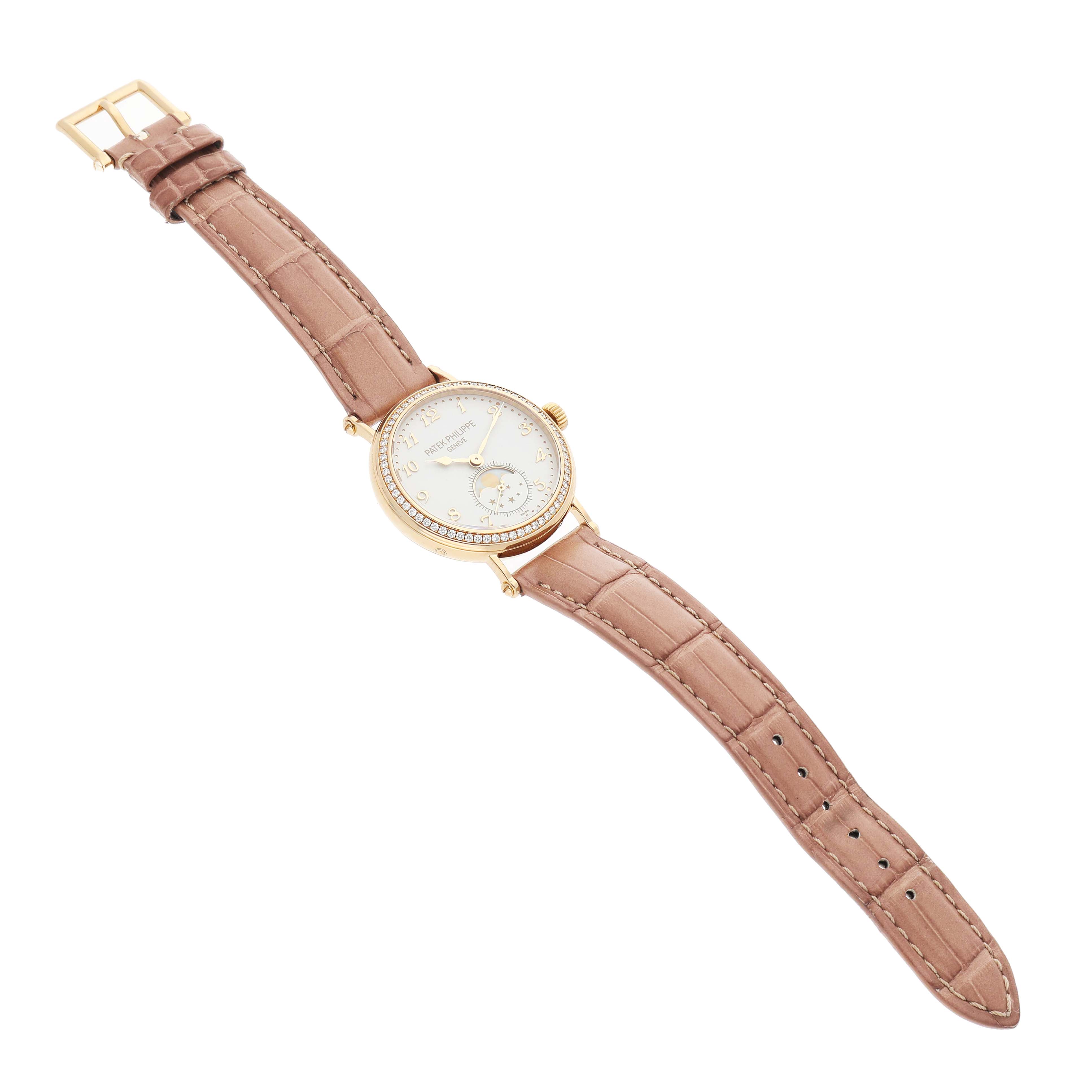 The Patek Philippe Calatrava 7121J-001 Women's Yellow Gold Silver Dial watch is shown at a slight angle, displaying the gold case, dial, and brown leather strap.