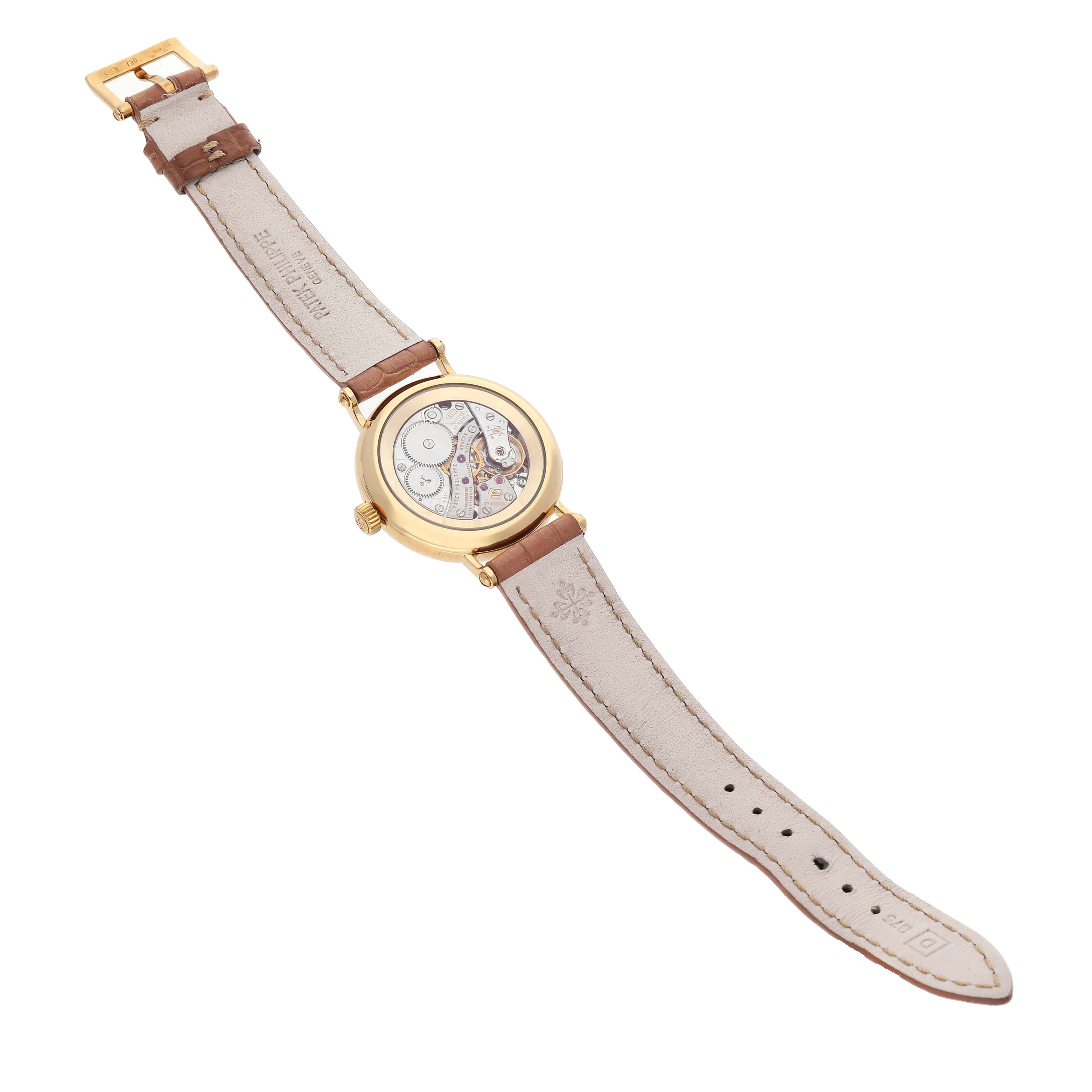 The watch is shown from the back, displaying the movement and inside of the leather strap of the Patek Philippe Calatrava 7121J-001 Women's Yellow Gold Silver Dial model.