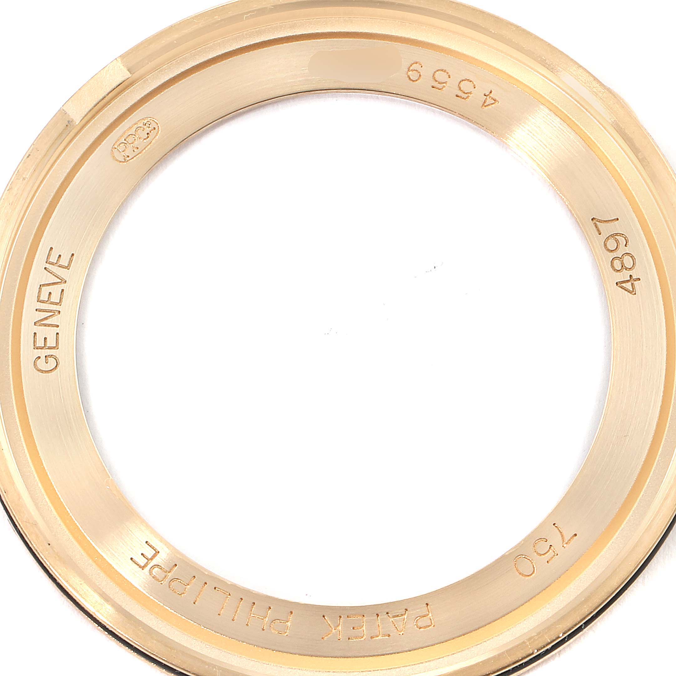 This image shows the back case bezel of a Patek Philippe Calatrava 4897R-010 Women
s Rose Gold Beige Dial 4897R-010 Women
s Rose Gold Beige Dial watch, highlighting engraved details.