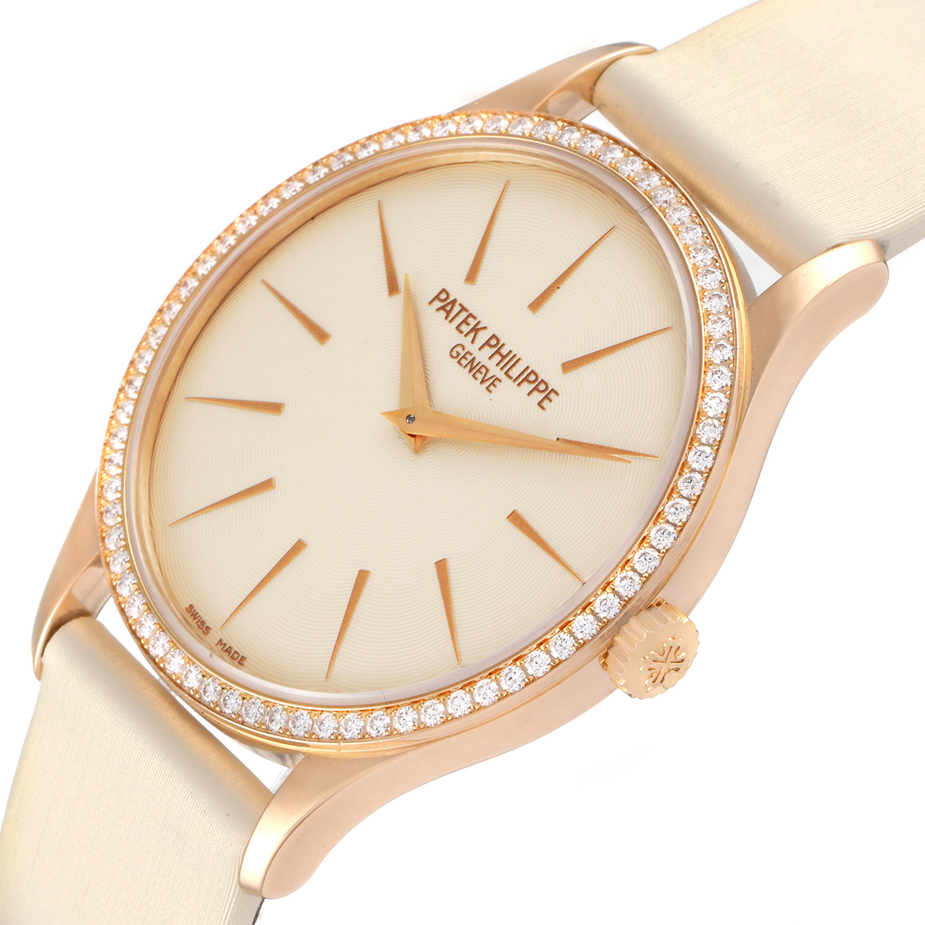 This image shows a close-up angle of the Patek Philippe Calatrava 4897R-010 Women
s Rose Gold Beige Dial 4897R-010 Women
s Rose Gold Beige Dial watch, highlighting its face, bezel, and part of the strap.