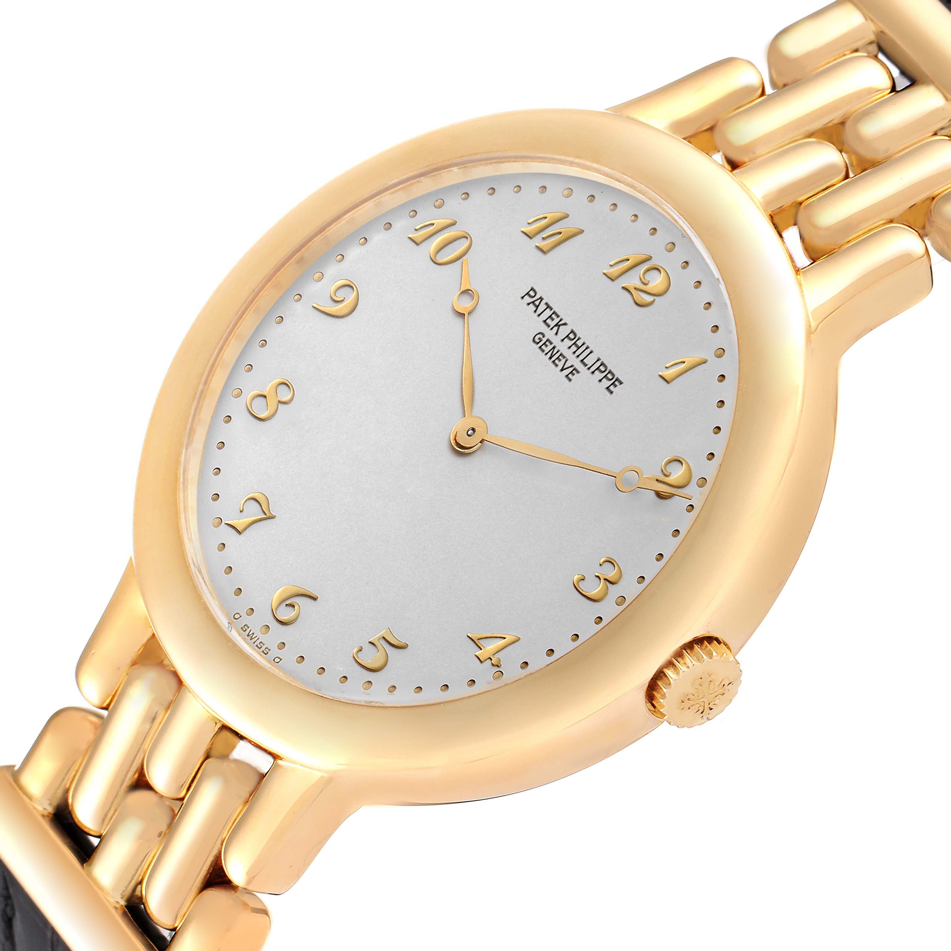 A Patek Philippe Calatrava 3915J Men's Yellow Gold Silver Dial 3915J Men's Yellow Gold Silver Dial watch viewed at an angle, showing the face, dial, crown, and part of the bracelet.