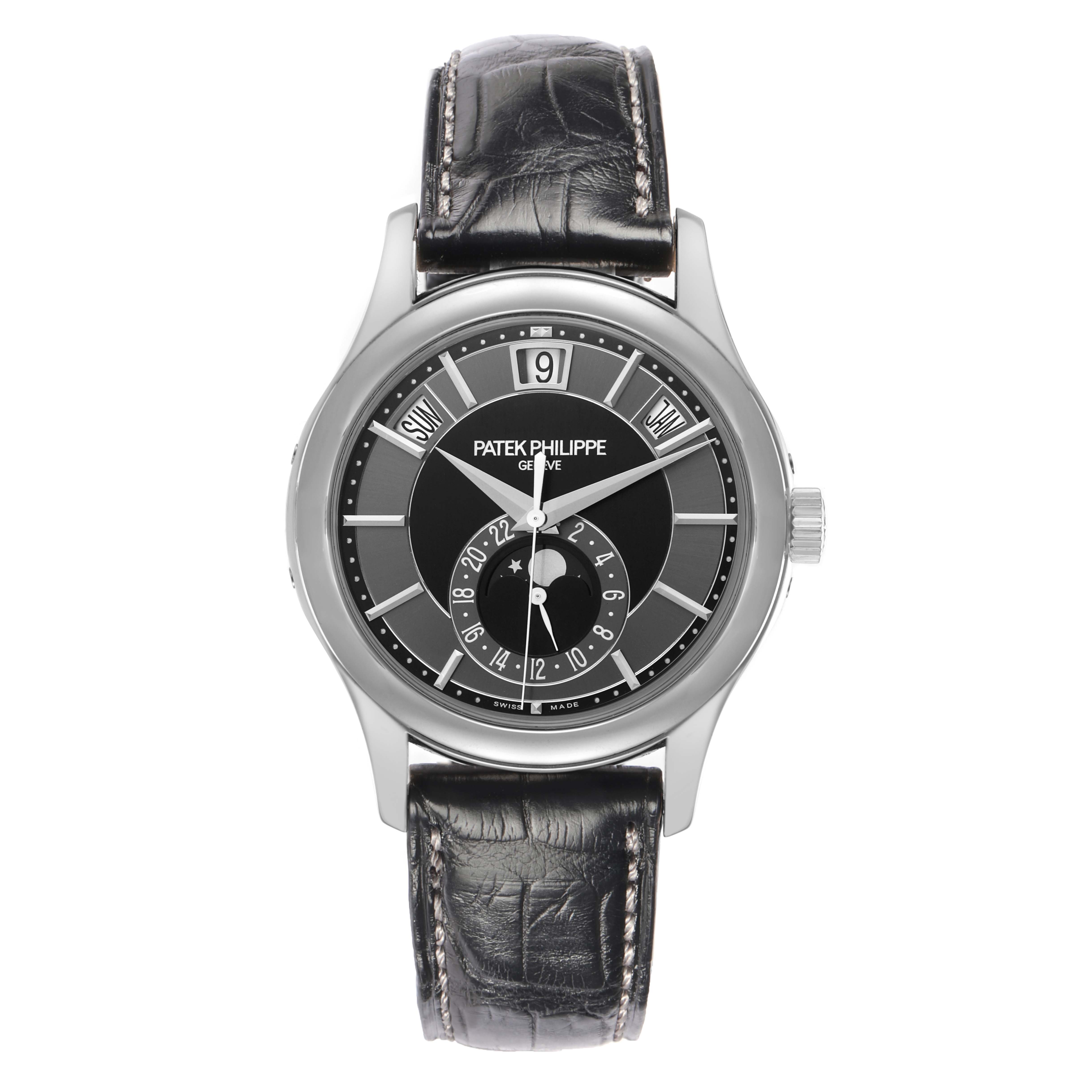 The Patek Philippe Complications 5205 Men
s White Gold Black Dial watch is shown from a front angle, highlighting the dial, hands, and leather strap.
