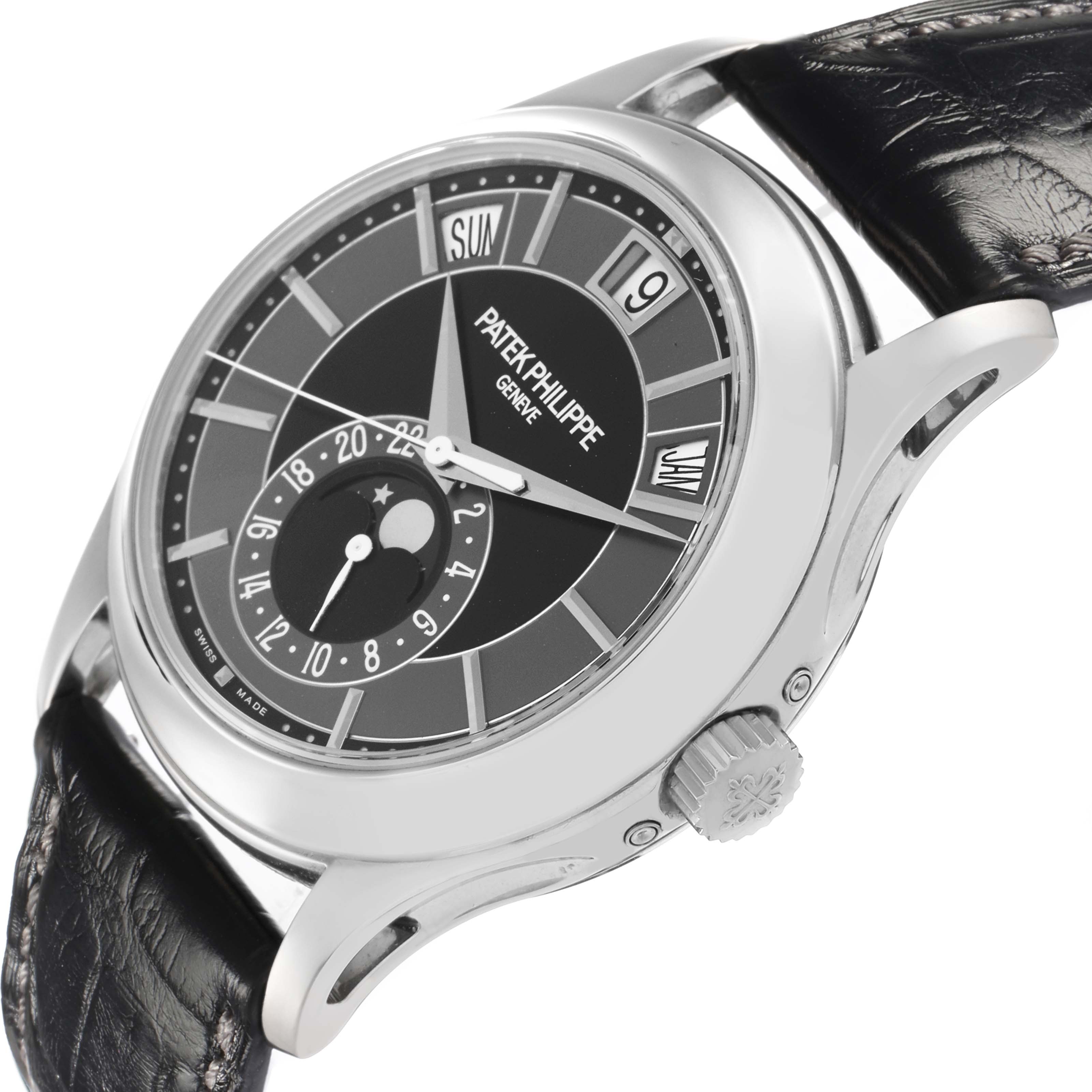 The image shows a Patek Philippe Complications 5205 Men
s White Gold Black Dial watch at a three-quarter side angle, highlighting the dial, bezel, crown, and strap.