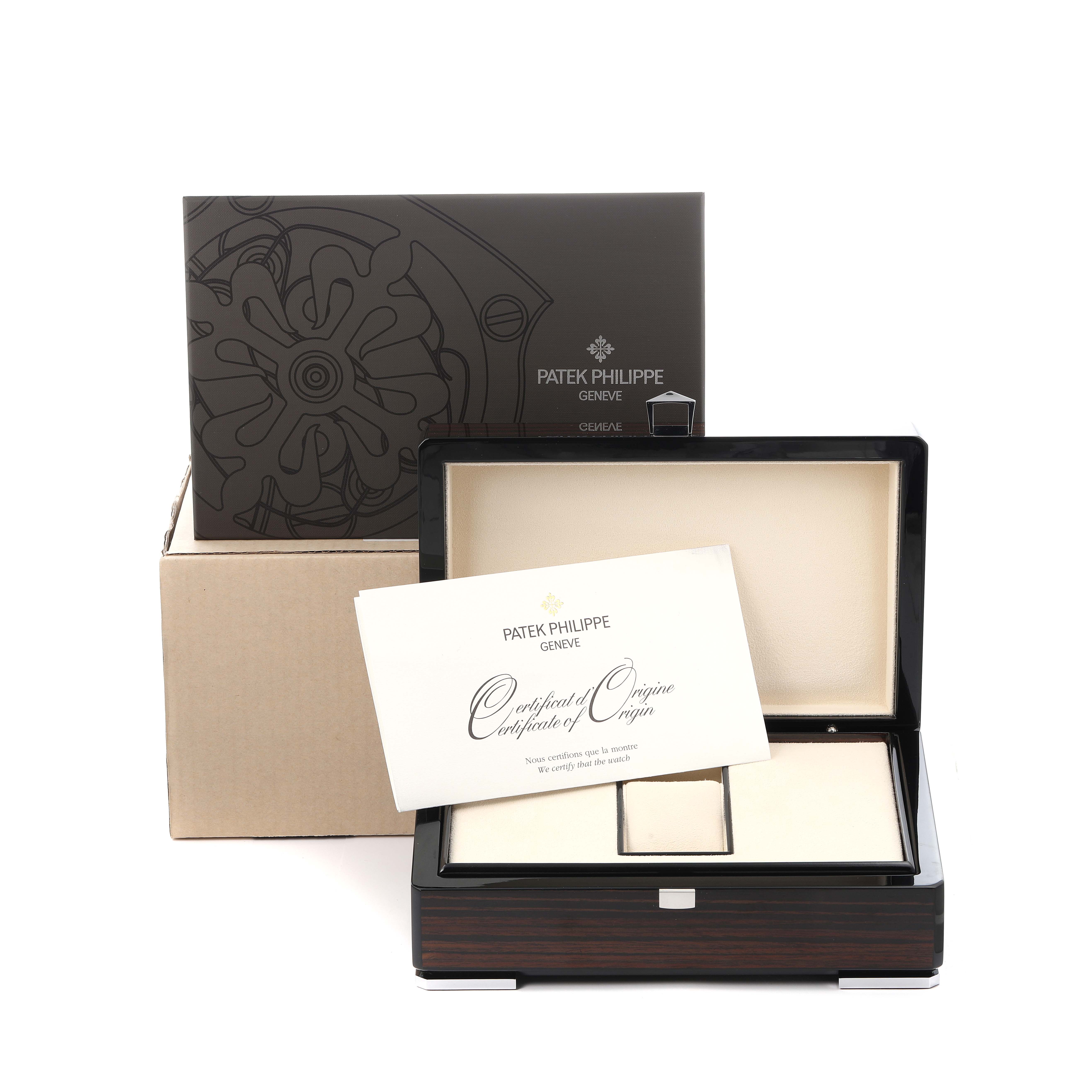The image shows the packaging for a Patek Philippe Complications 5205 Men
s White Gold Black Dial model, with a box, certificate, and outer packaging.