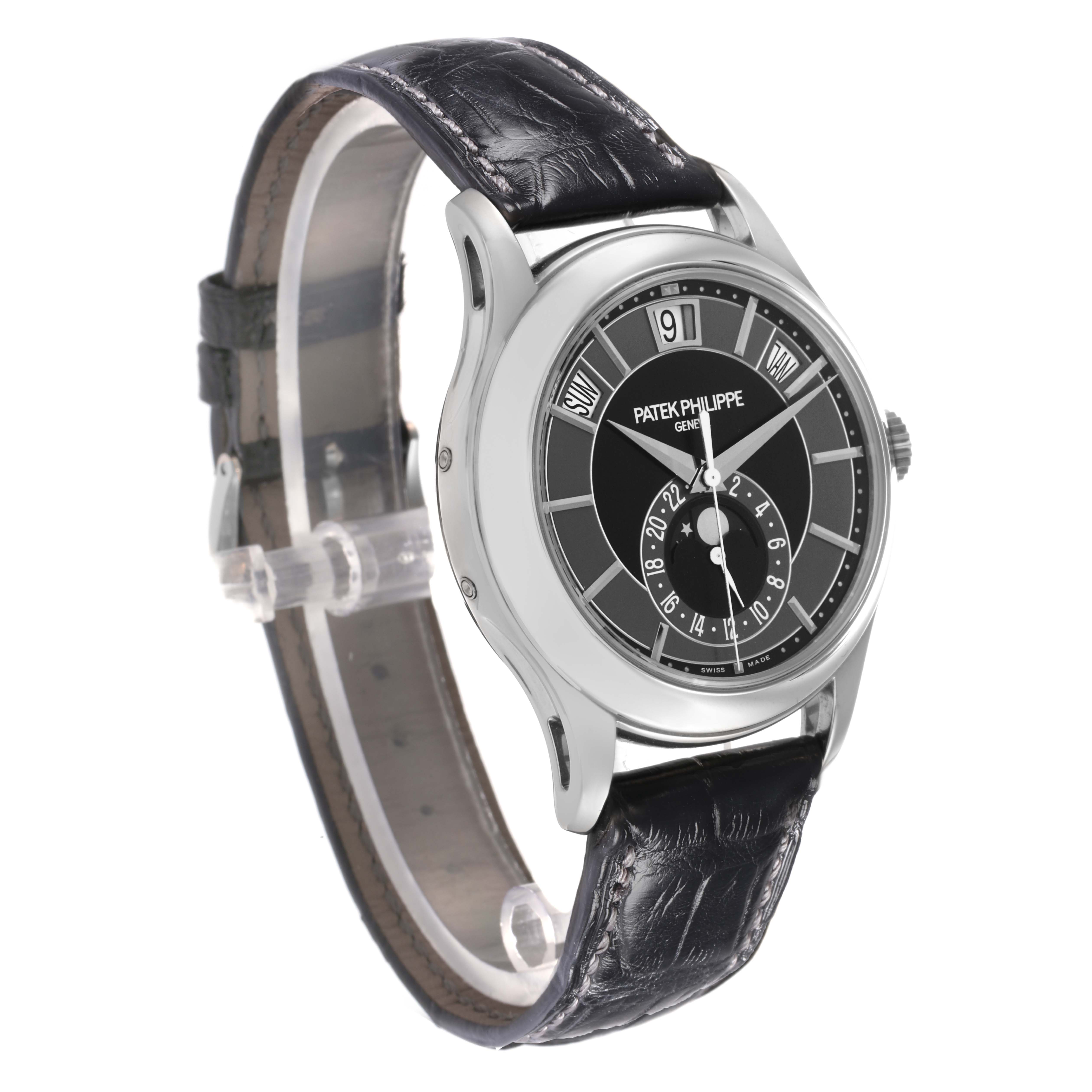 The Patek Philippe Complications 5205 Men
s White Gold Black Dial watch is shown at a three-quarter angle, highlighting the dial, bezel, case, and leather strap.