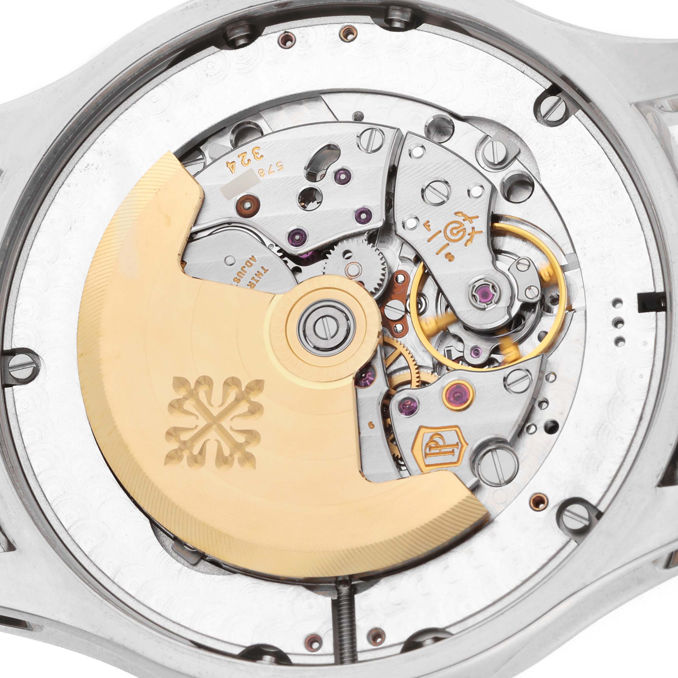 The image shows the movement of a Patek Philippe Complications 5205 Men
s White Gold Black Dial watch, viewed from the back, highlighting the rotor and intricate mechanics.