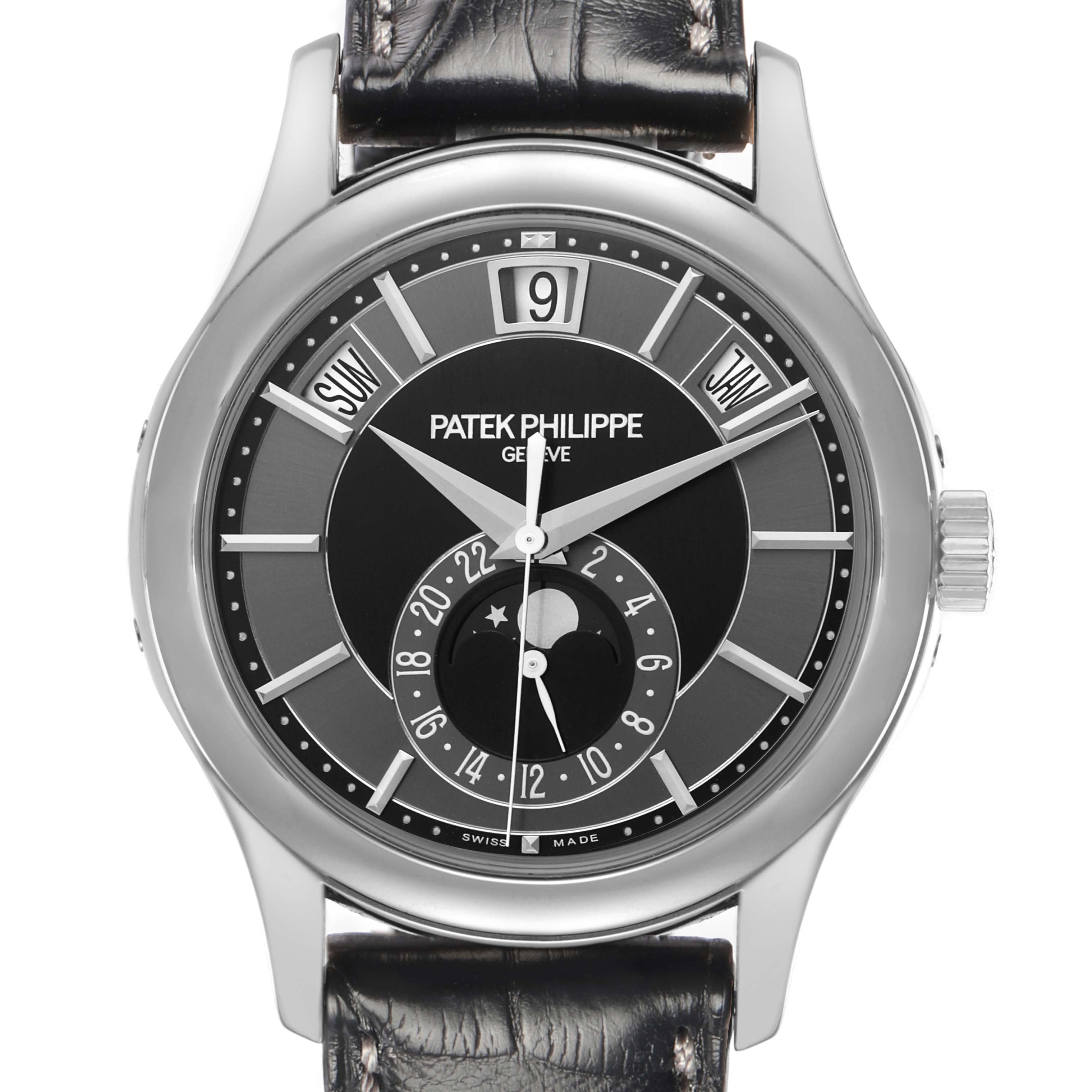 The image shows a frontal view of a Patek Philippe Complications 5205 Men
s White Gold Black Dial watch, highlighting the dial, case, and strap.