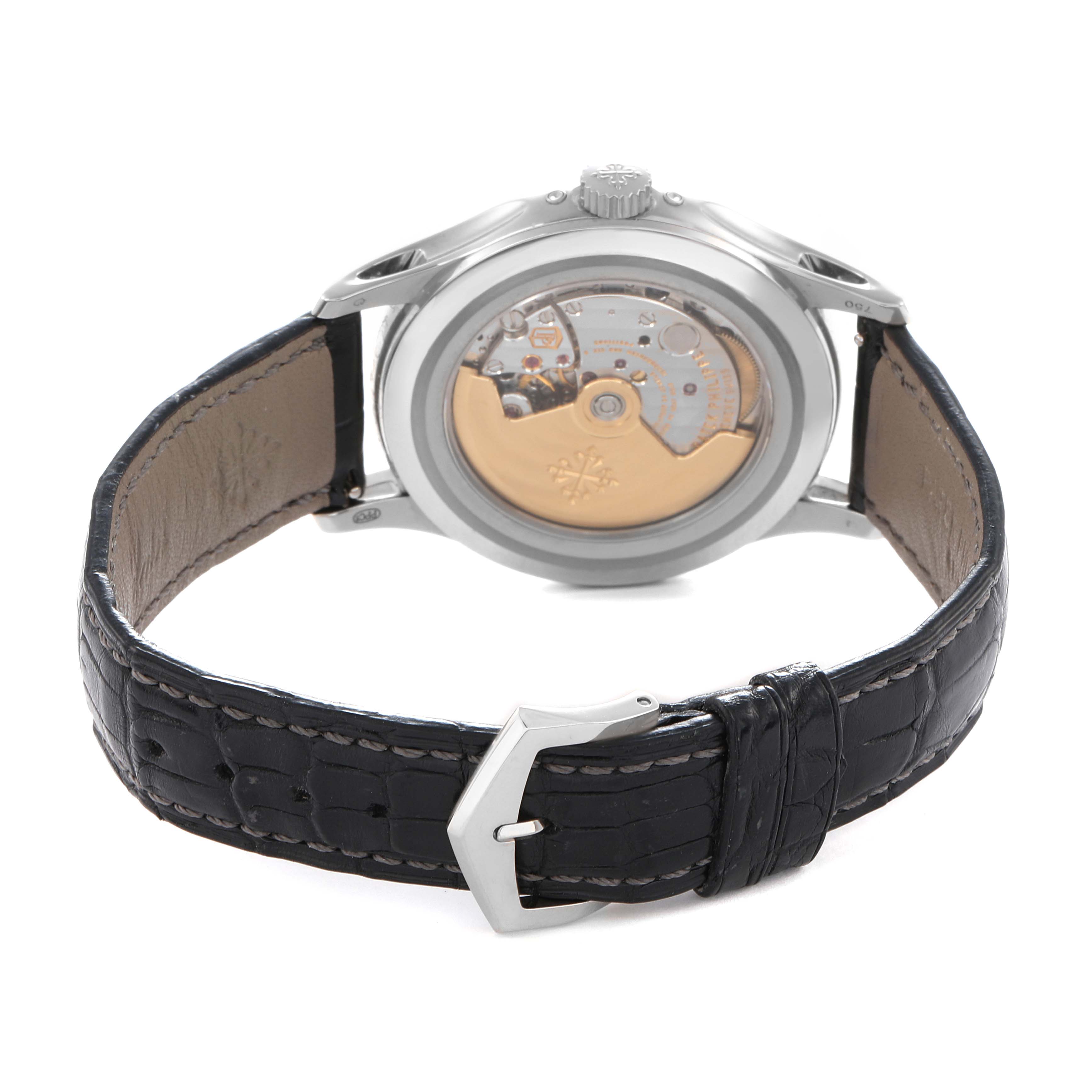 The image shows the back view of a Patek Philippe Complications 5205 Men
s White Gold Black Dial watch, highlighting the movement and leather strap.