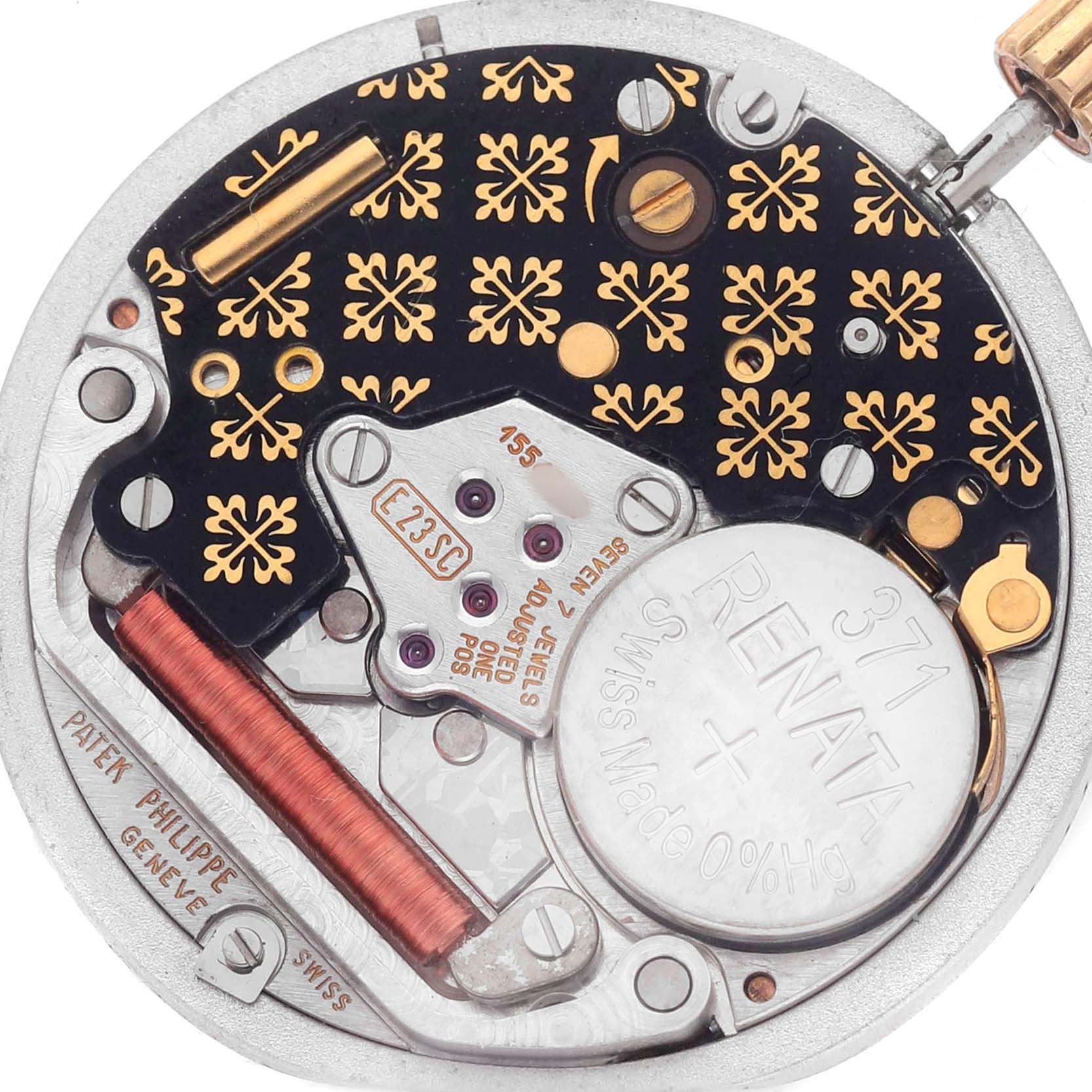 The image shows a close-up of the Patek Philippe Nautilus 3900/1 Women's Yellow Gold White Dial watch movement, highlighting its intricate mechanical components.