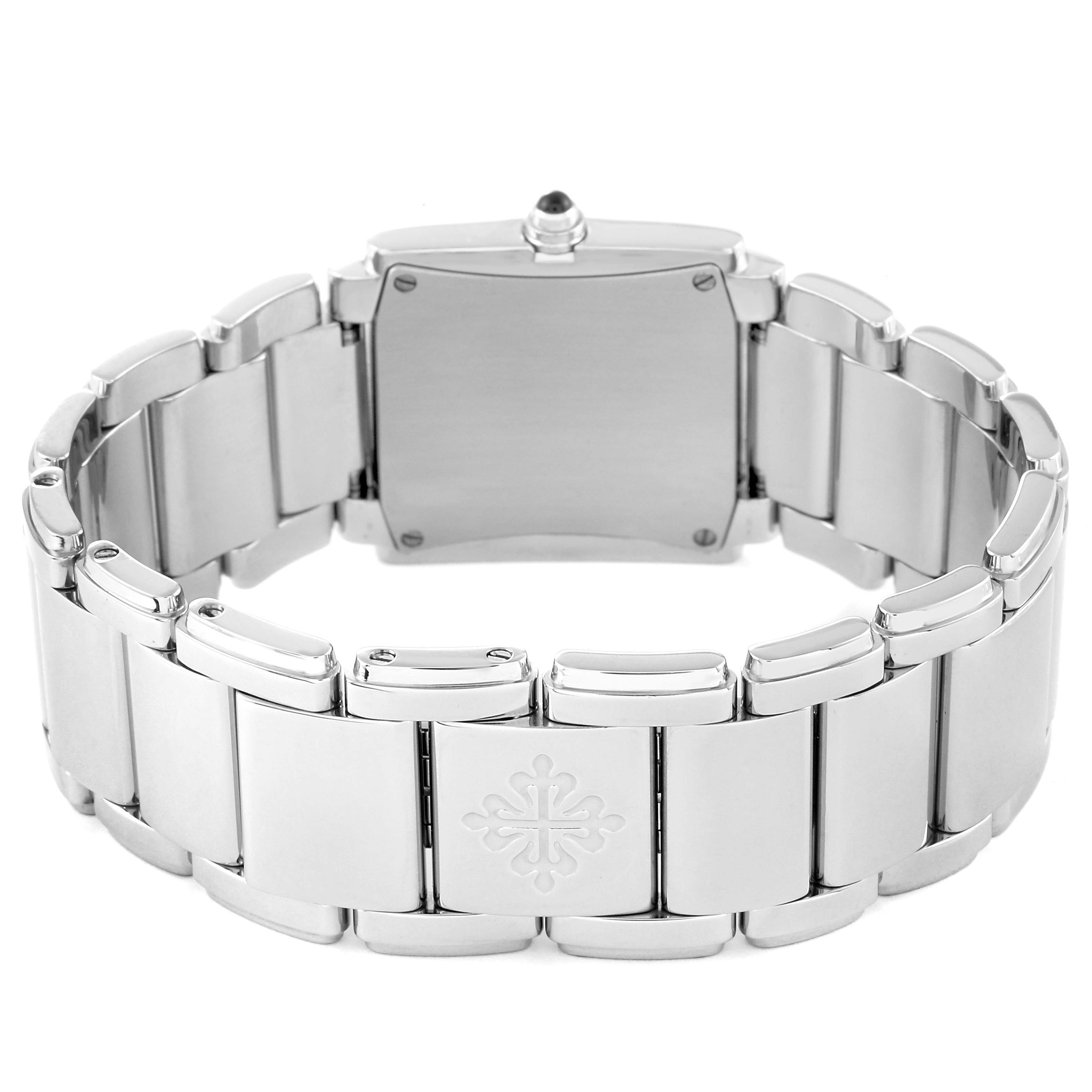The image shows the backside and bracelet of a Patek Philippe Twenty-4 4910/10 Women's White Gold Black Dial 4910/10 Women's White Gold Black Dial watch, highlighting the clasp and metal links.
