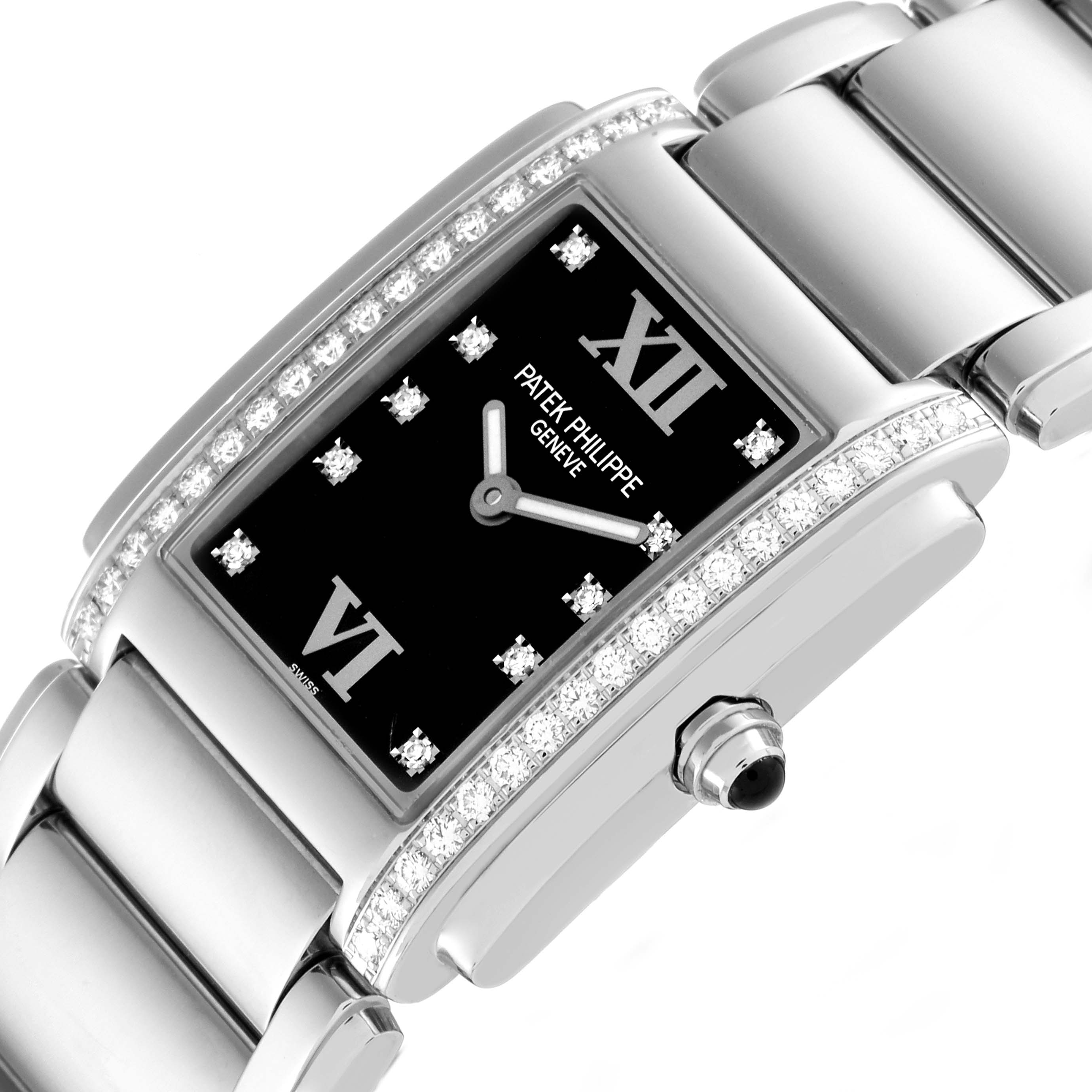 The image shows a close-up angled view of the dial, bezel with diamonds, and bracelet of the Patek Philippe Twenty-4 4910/10 Women's White Gold Black Dial 4910/10 Women's White Gold Black Dial watch.