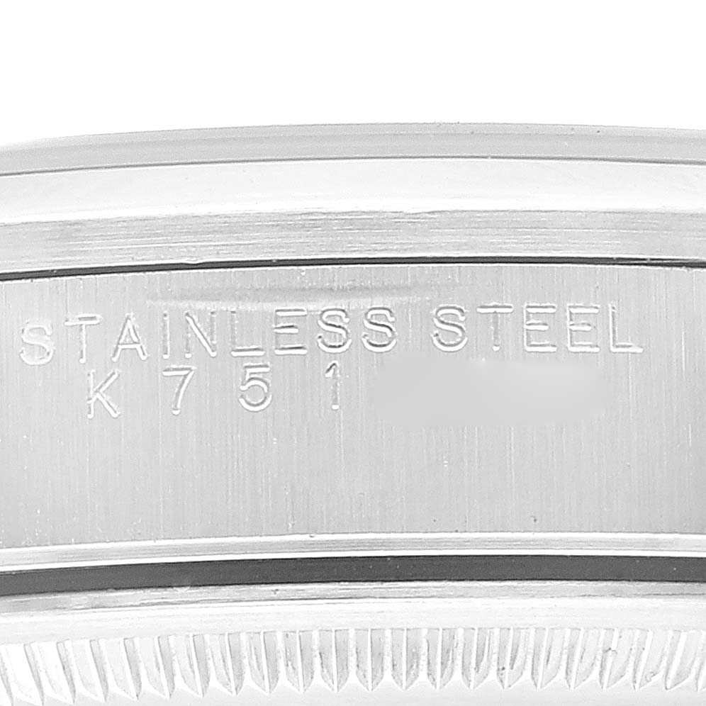 This image shows a close-up of the stainless steel case back of a Rolex Air-King 14000 Men's Stainless Steel Black Dial 14000 Men's Stainless Steel Black Dial watch, featuring engraved text.