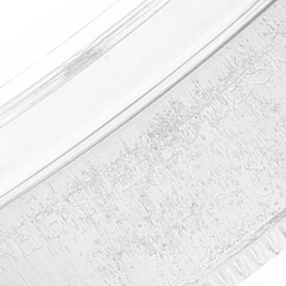 The image shows a close-up of the side of the bezel of the Rolex Air-King 5500 Men's Stainless Steel Silver Dial 5500 Men's Stainless Steel Silver Dial watch.