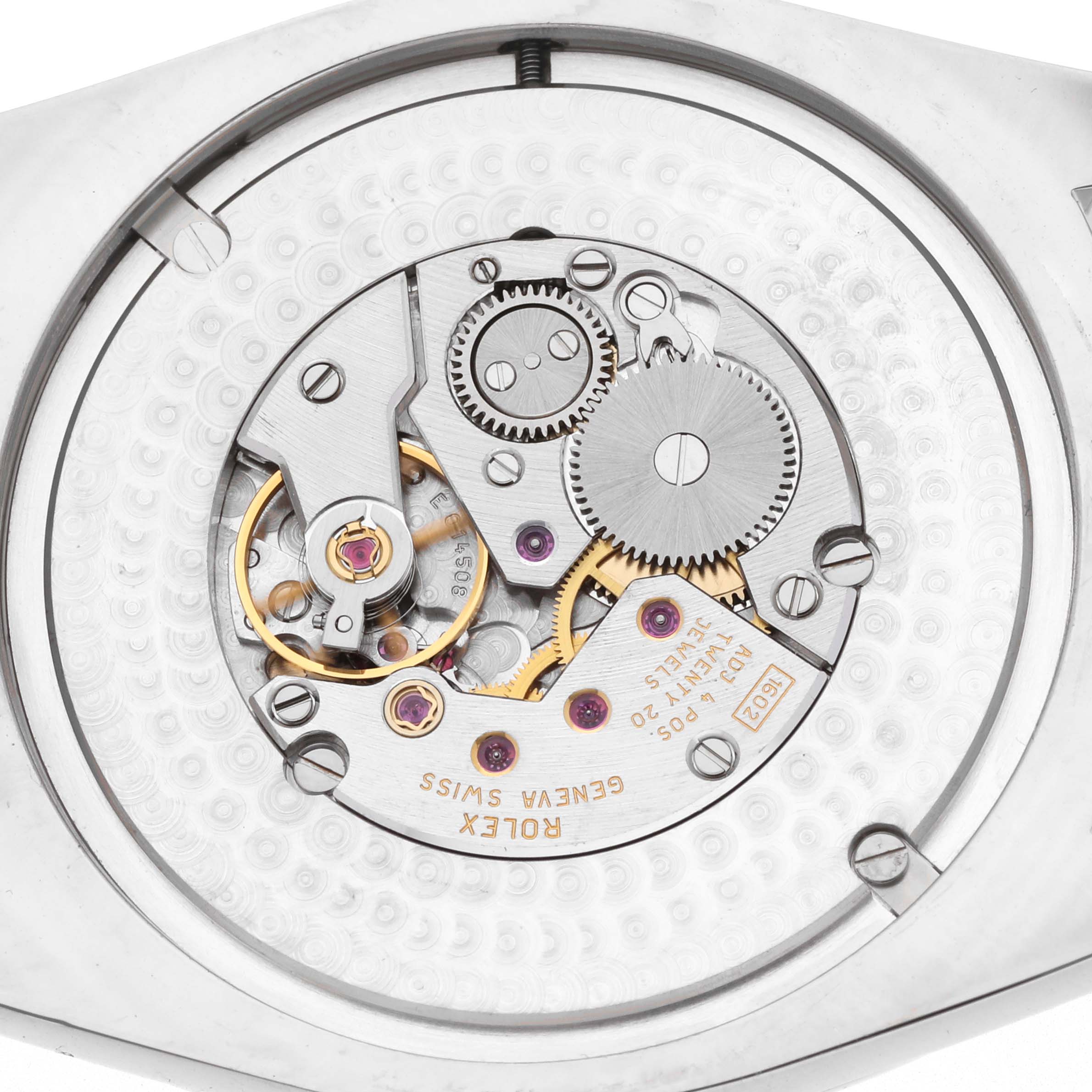 The image shows the movement of a Rolex Cellini 4243 Men
s White Gold Silver Dial watch with visible gears and components from a top-down angle.