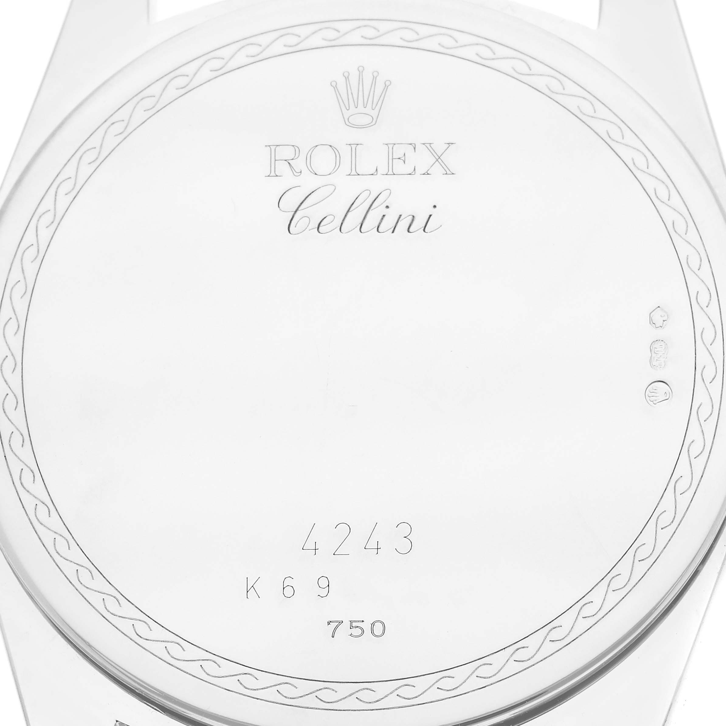 This image shows the back of a Rolex Cellini 4243 Men
s White Gold Silver Dial watch case with engravings and hallmarks.