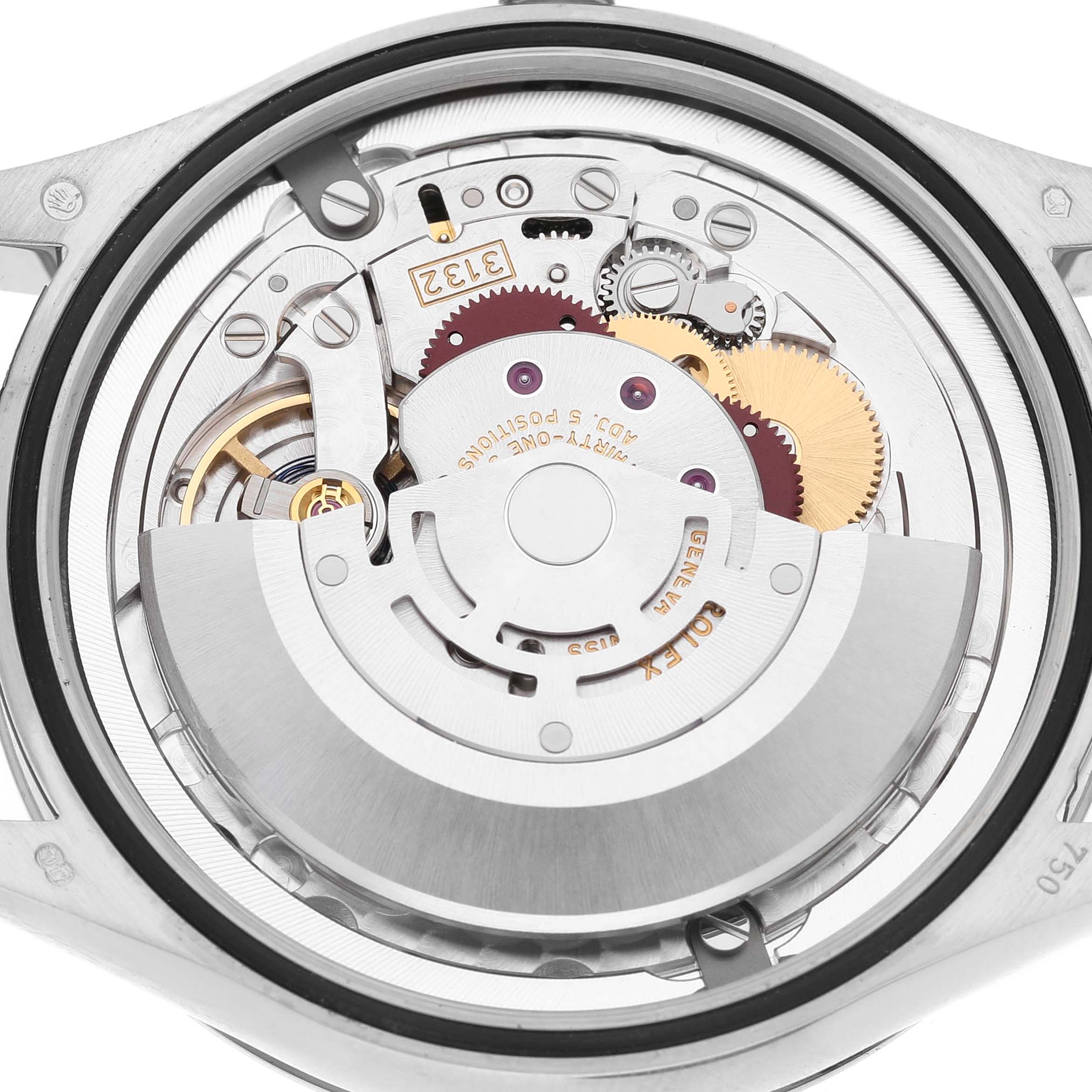 The image shows a detailed view of the Rolex Cellini 50709 Men's White Gold Black Dial's movement from the back, highlighting gears and mechanisms.