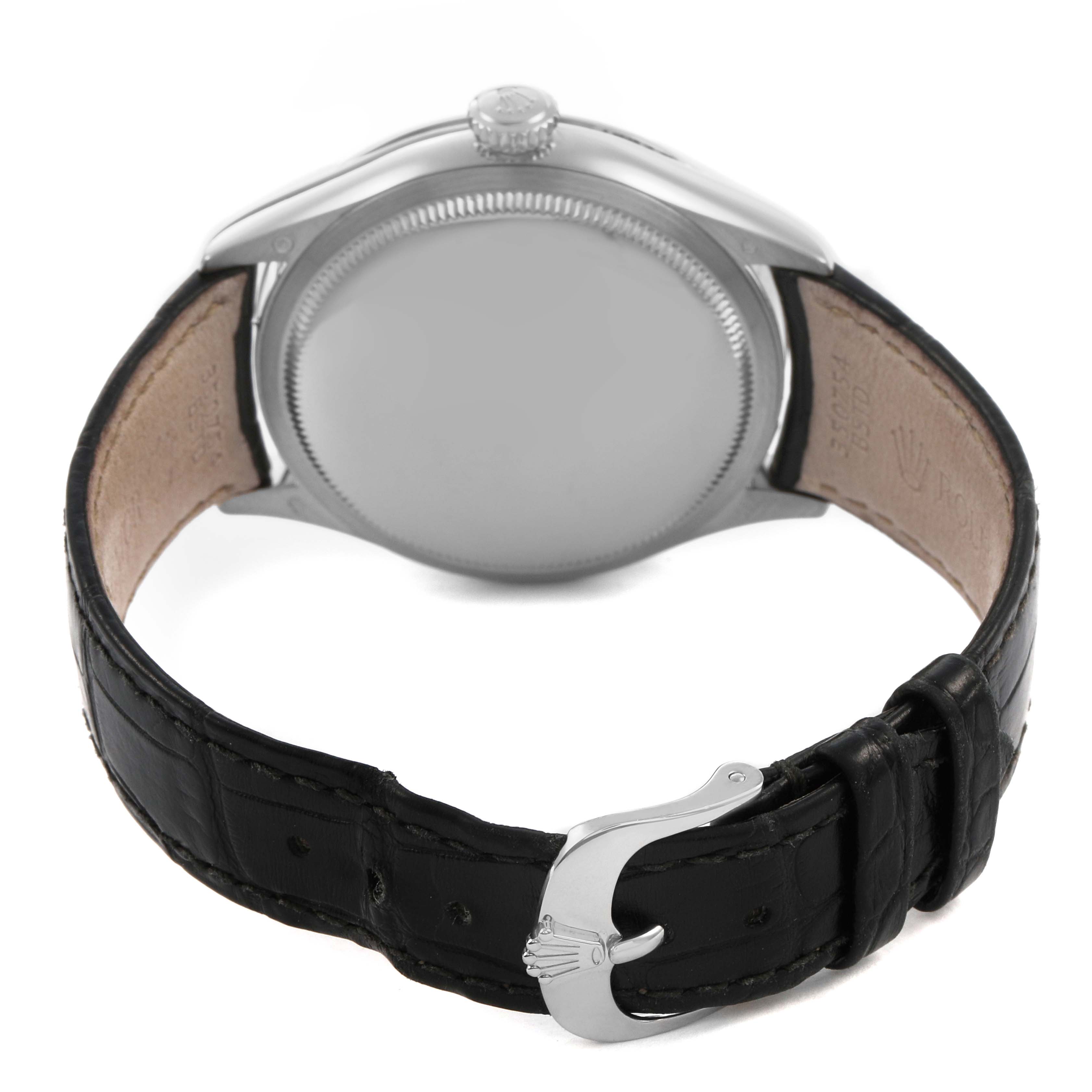 The image shows the back view of a Rolex Cellini 50709 Men's White Gold Black Dial watch, featuring the case back and the black leather strap with a clasp.