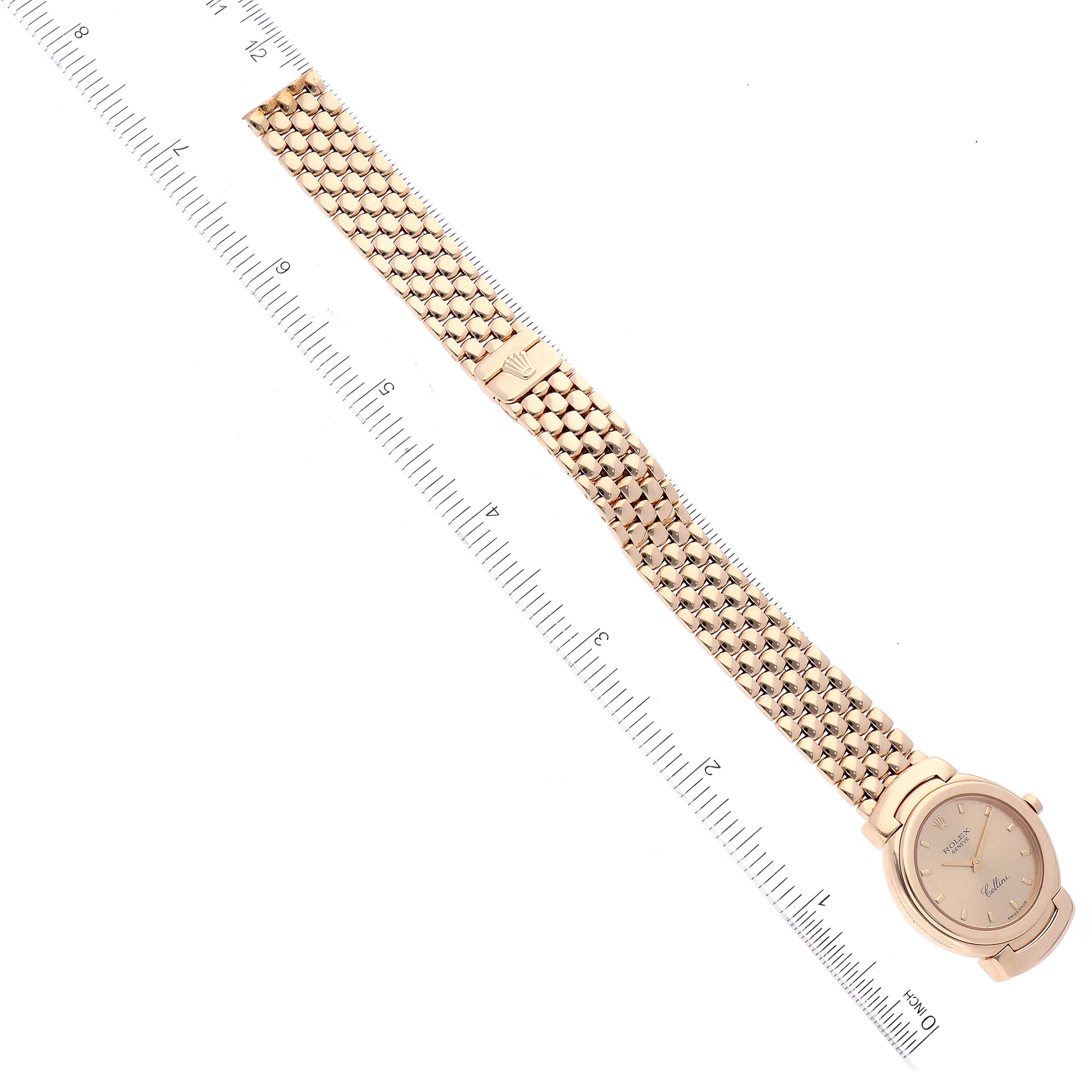The image shows a Rolex Cellini 6621 Women's Yellow Gold Champagne Dial 6621 Women's Yellow Gold Champagne Dial watch lying flat with its entire bracelet and face visible, alongside a ruler for measurement.