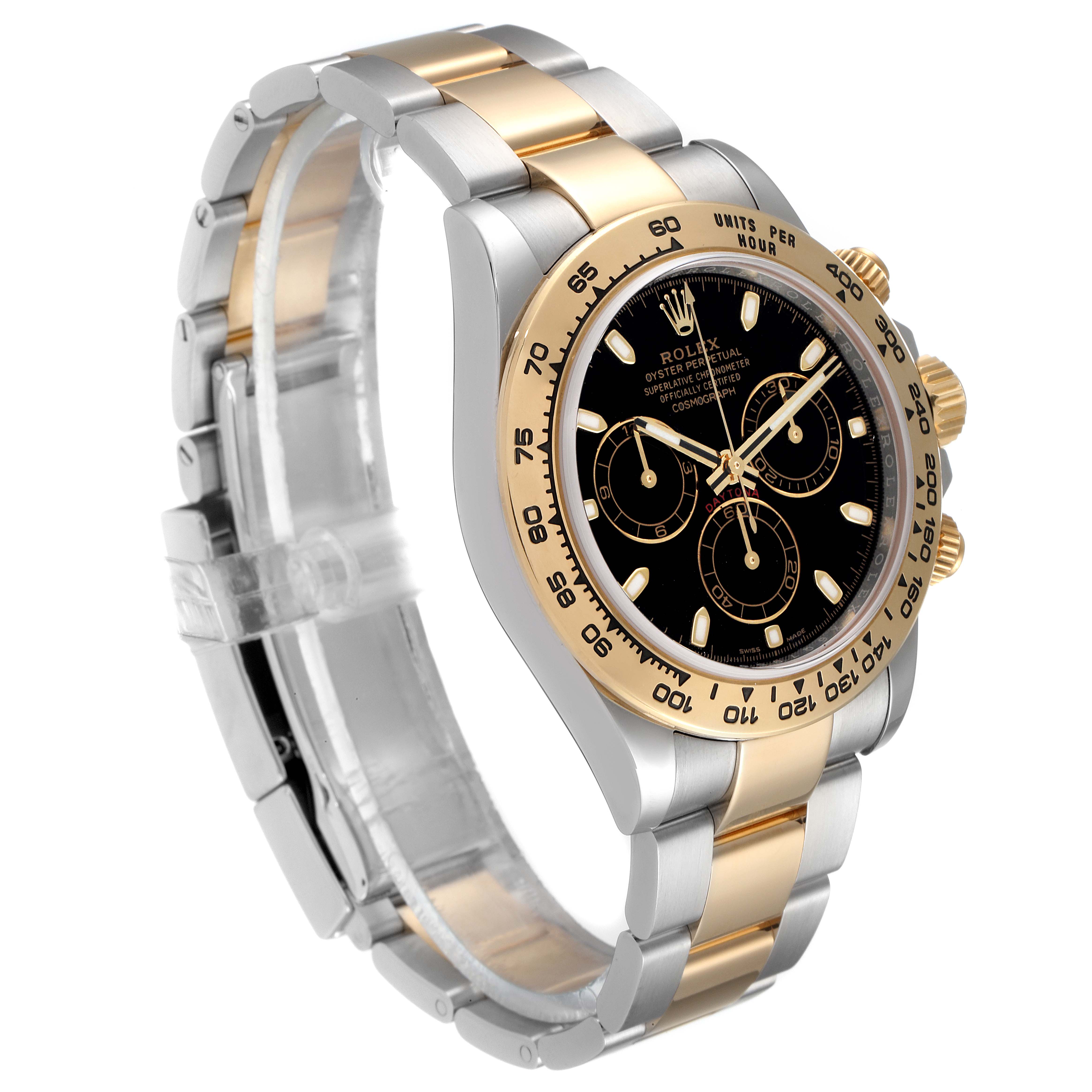 The image shows a side angle of a Rolex Daytona 116503 Men
s Steel and Gold (two tone) Black Dial 116503 Men
s Steel and Gold (two tone) Black Dial watch featuring a black dial, and gold and silver bracelet.