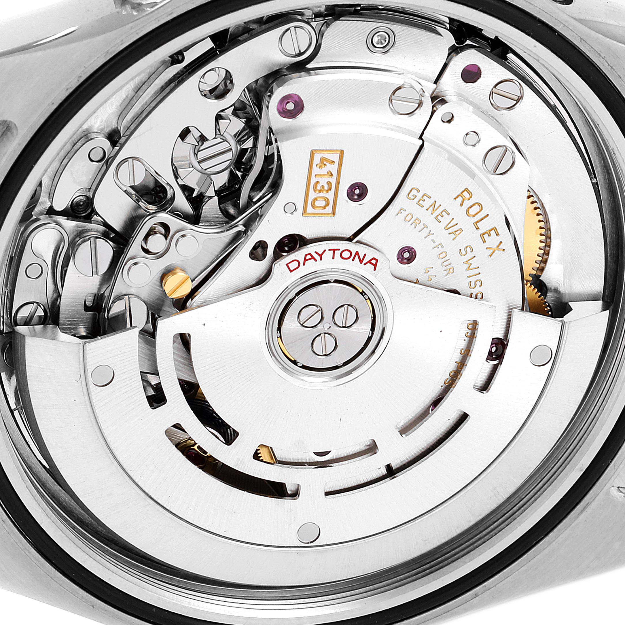 The image shows a close-up view of the movement and intricate internal mechanisms of a Rolex Daytona 116503 Men
s Steel and Gold (two tone) Black Dial 116503 Men
s Steel and Gold (two tone) Black Dial watch.