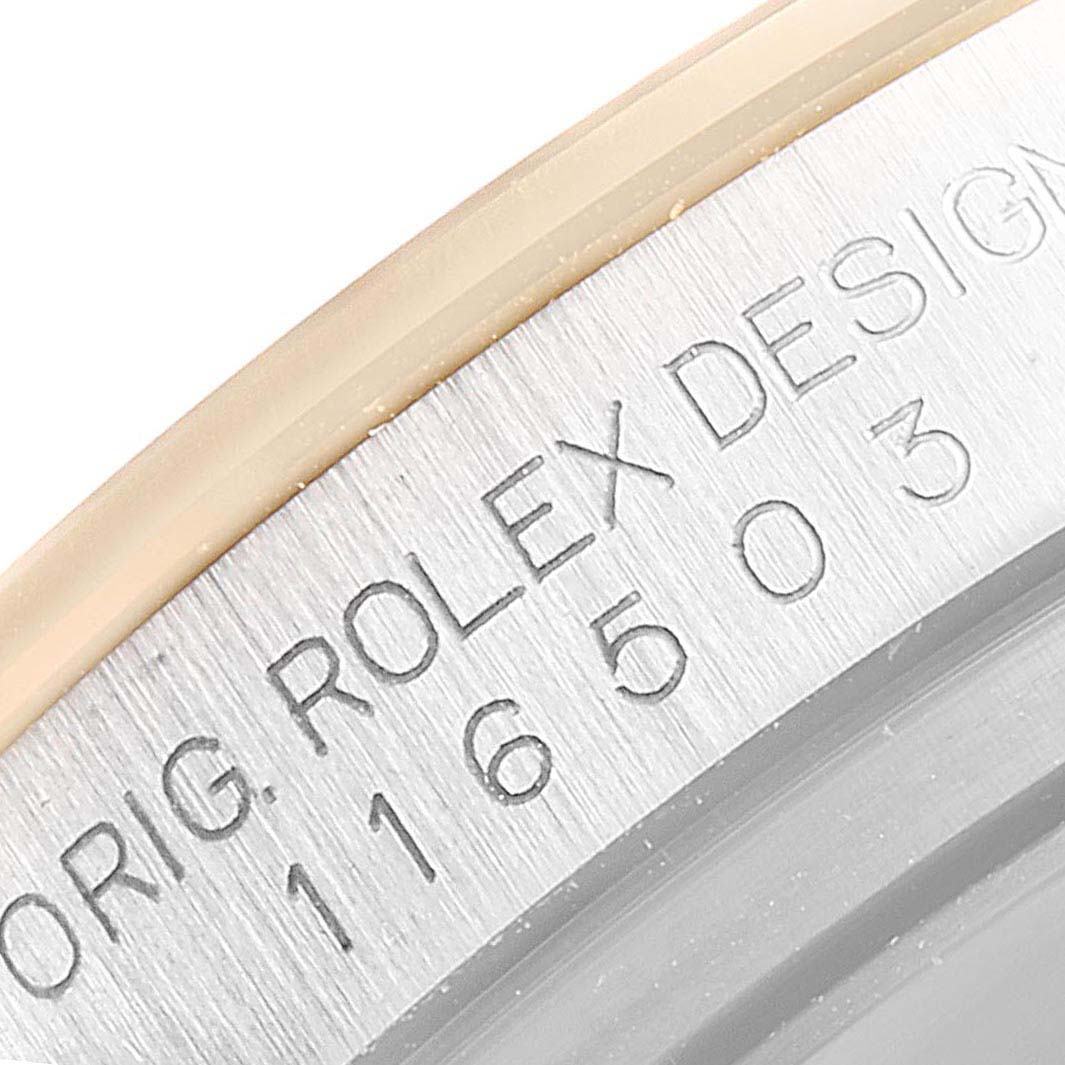This image shows a close-up of the engraved serial number and design details on the case side of a Rolex Daytona 116503 Men
s Steel and Gold (two tone) Black Dial 116503 Men
s Steel and Gold (two tone) Black Dial watch.