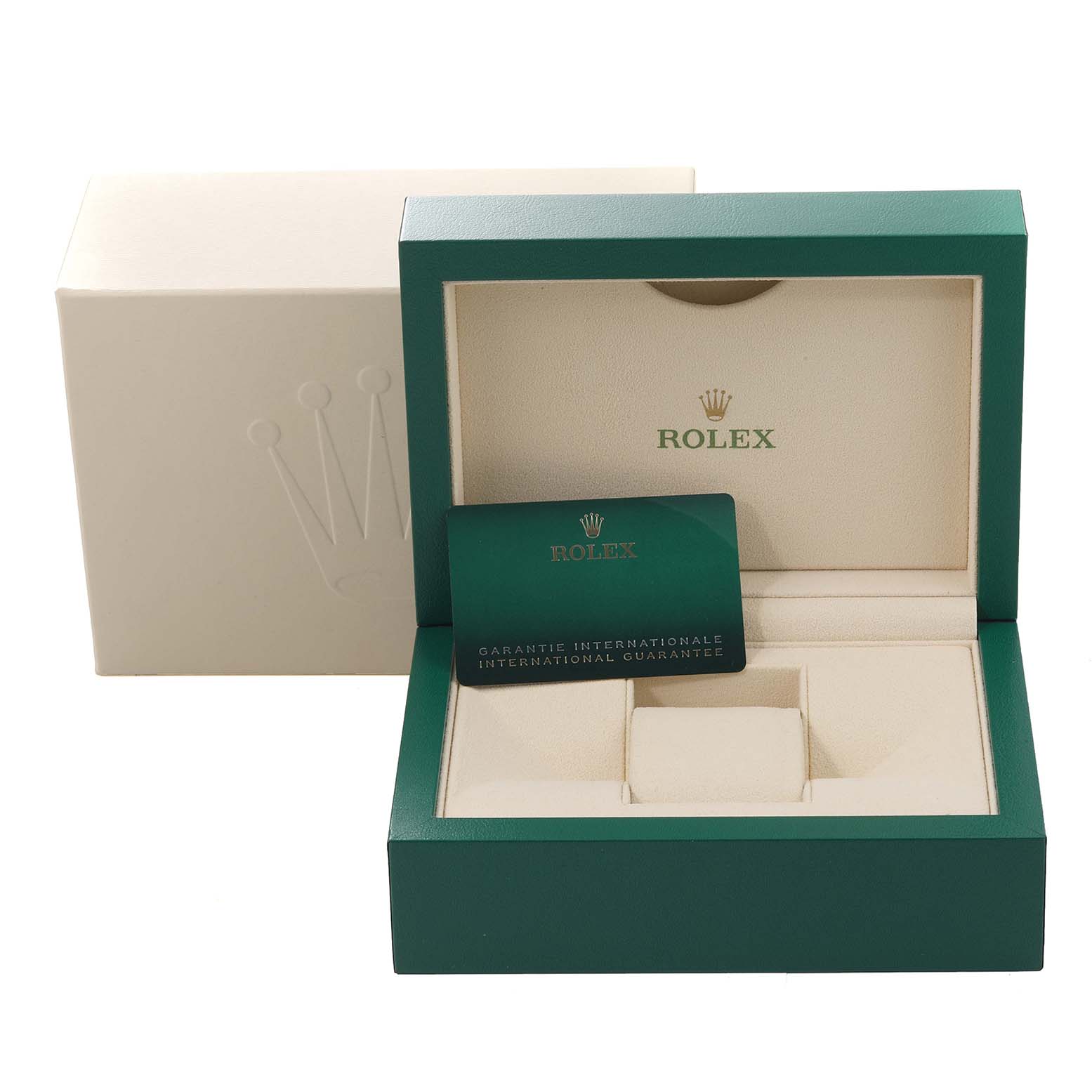 The image shows an open green Rolex box for the Daytona model, featuring a guarantee card and cushioned interior compartments.