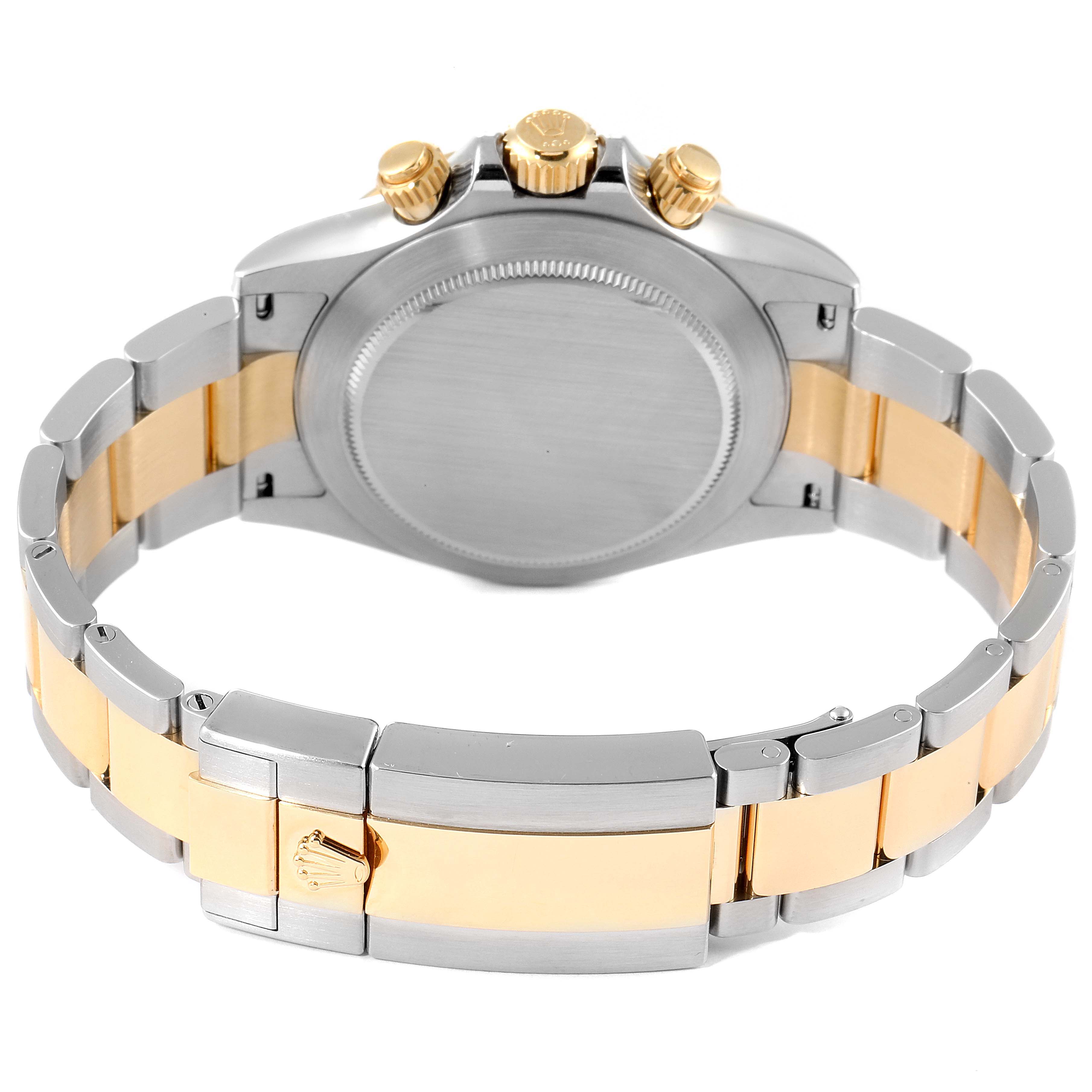 This image shows the back view and band of a Rolex Daytona 116503 Men
s Steel and Gold (two tone) Champagne Dial 116503 Men
s Steel and Gold (two tone) Champagne Dial watch, highlighting its combination of stainless steel and gold elements.