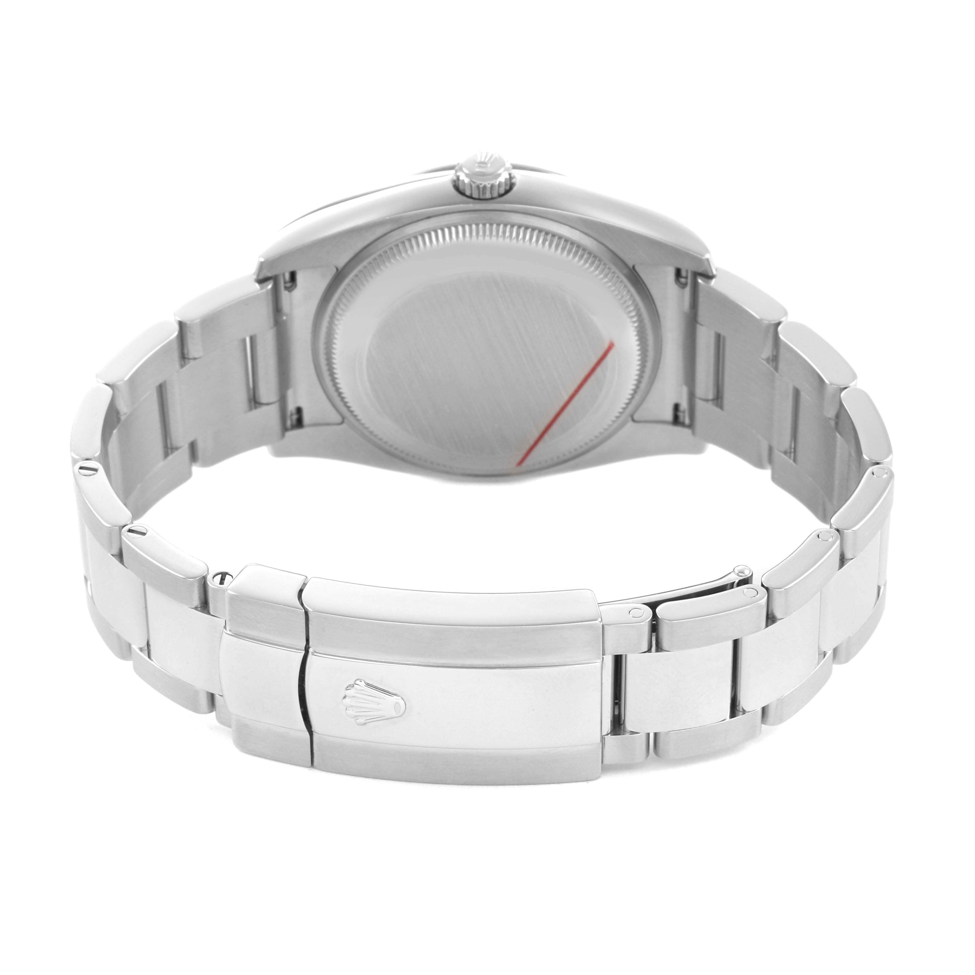 The image shows the back view of a Rolex Date 115234 Men's Stainless Steel Silver Dial model, highlighting the case back and clasp of the bracelet.