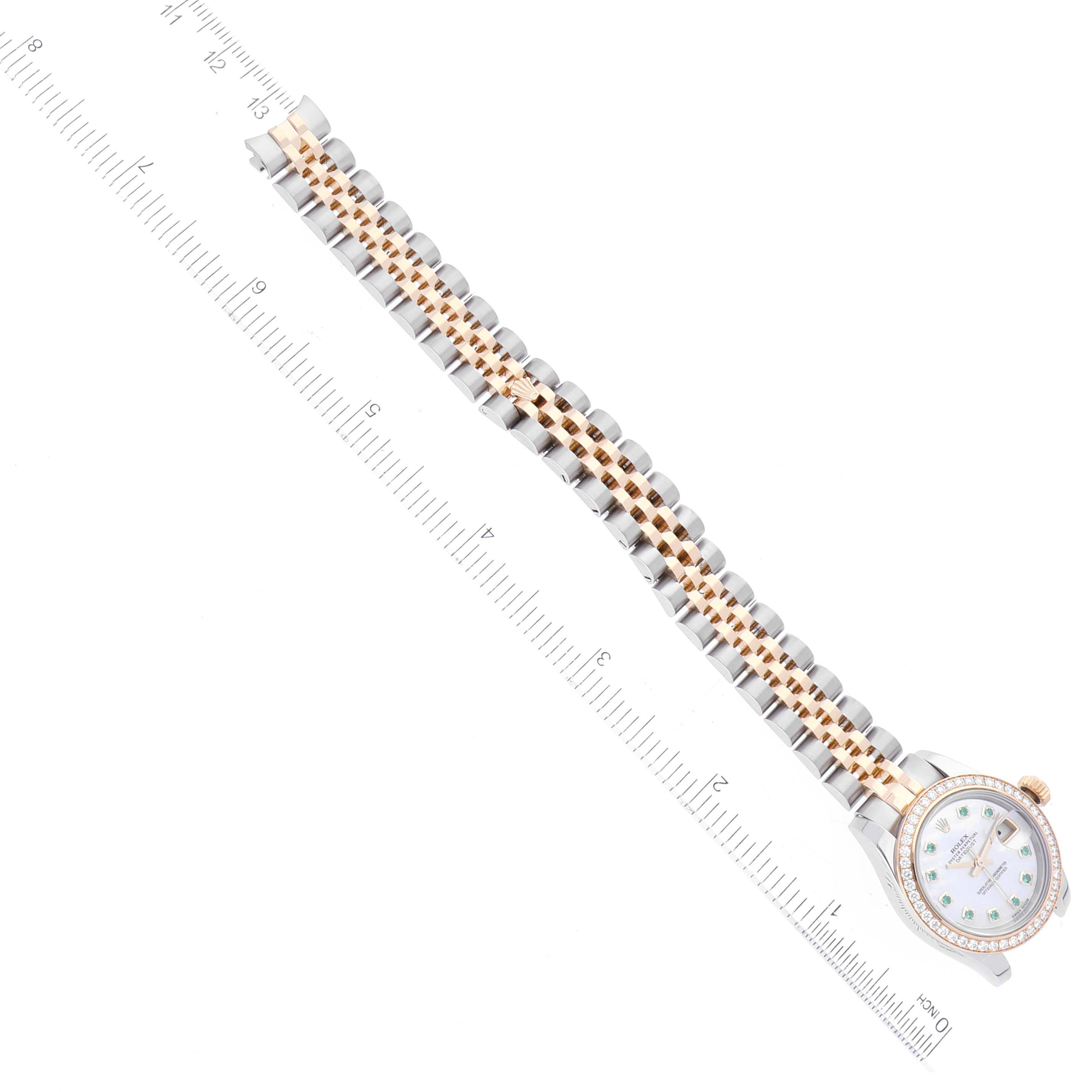 The image shows a top-down view of a Rolex Datejust 179383 Women's Steel and Gold (two tone) Mother of Pearl Dial 179383 Women's Steel and Gold (two tone) Mother of Pearl Dial model watch, focusing on its face, bracelet, and part of a ruler for scale.