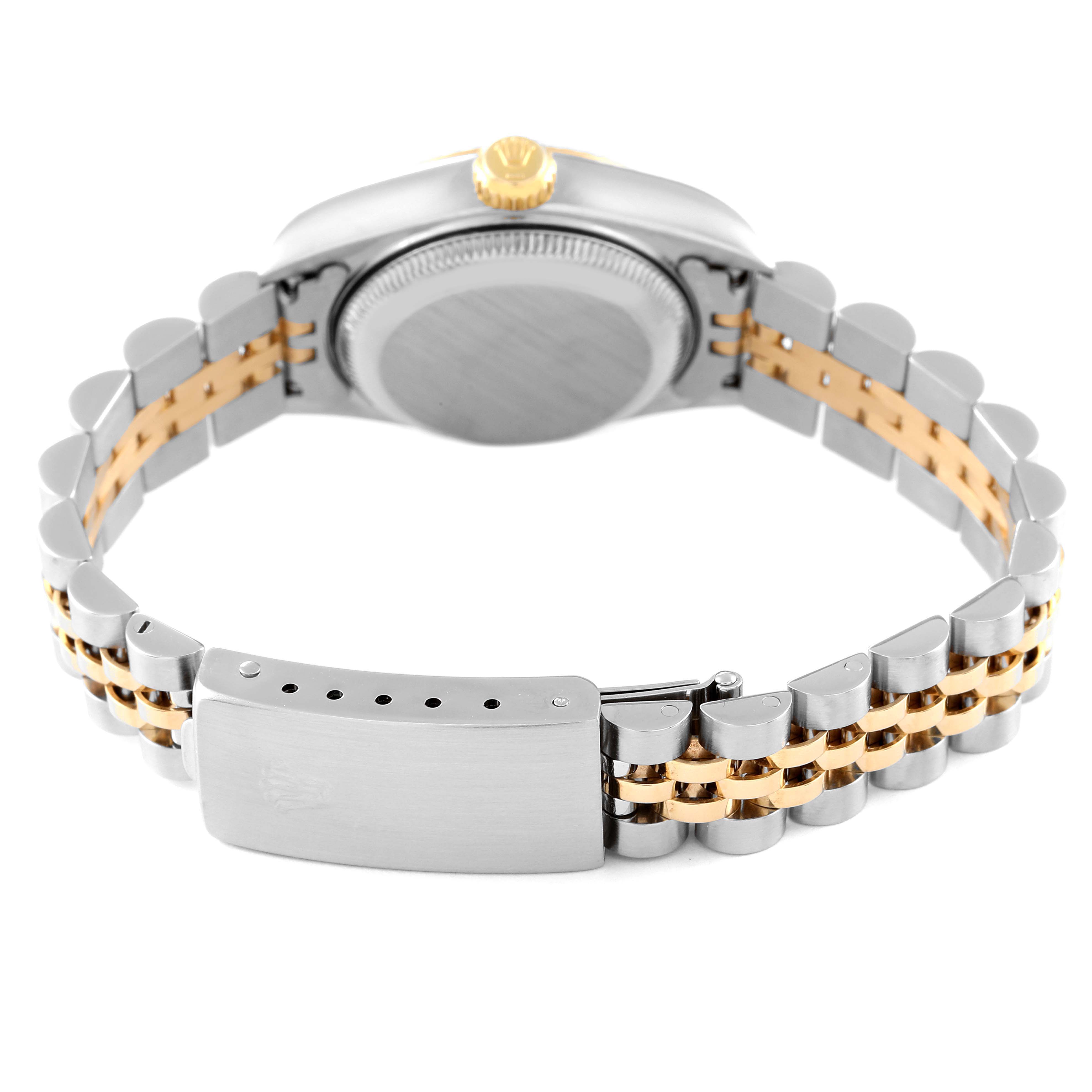 This image shows the backside of the Rolex Datejust 79173 Women's Steel and Gold (two tone) Beige Dial 79173 Women's Steel and Gold (two tone) Beige Dial watch, highlighting the bracelet and the clasp.