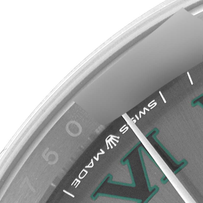 The image shows a close-up view of the dial and part of the bezel of a Rolex Datejust 126200 Men
s Stainless Steel Grey Dial 126200 Men
s Stainless Steel Grey Dial watch, highlighting the Roman numeral "VI" and "Swiss Made" text.