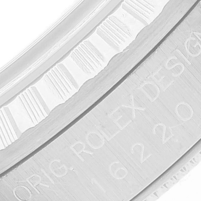 This close-up image shows the side engraving and partial bezel of a Rolex Datejust 16220 Men's Stainless Steel Pink Dial 16220 Men's Stainless Steel Pink Dial watch.