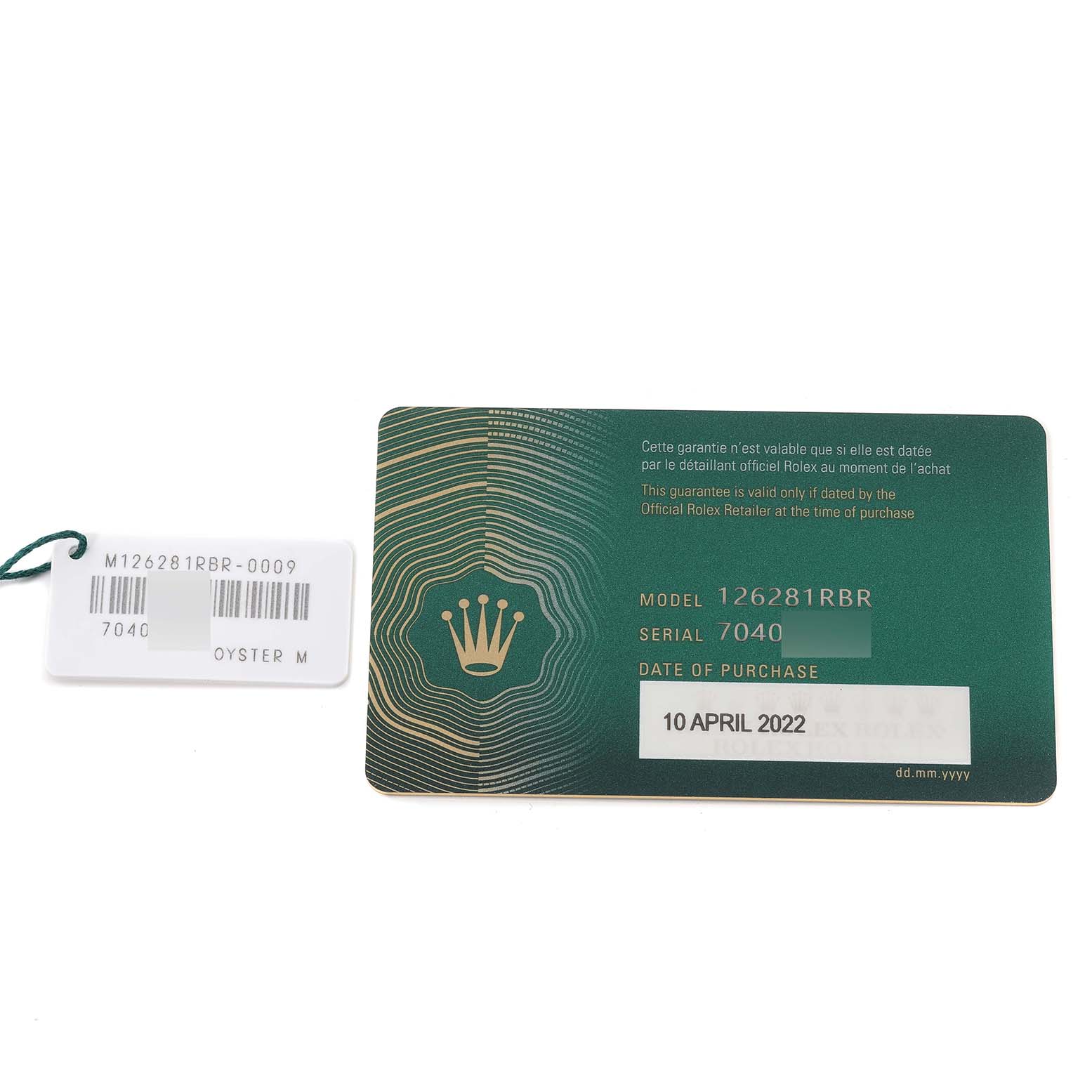 This image shows the warranty card and model tag for a Rolex Datejust 126281 Men's Steel and Gold (two tone) Mother of Pearl Dial 126281 Men's Steel and Gold (two tone) Mother of Pearl Dial model 126281RBR.