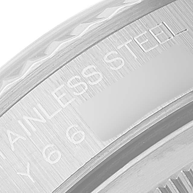 This close-up image shows part of the bezel and the engraved text on the inner ring of a Rolex Datejust 16234 Men's Stainless Steel Black Dial 16234 Men's Stainless Steel Black Dial watch.