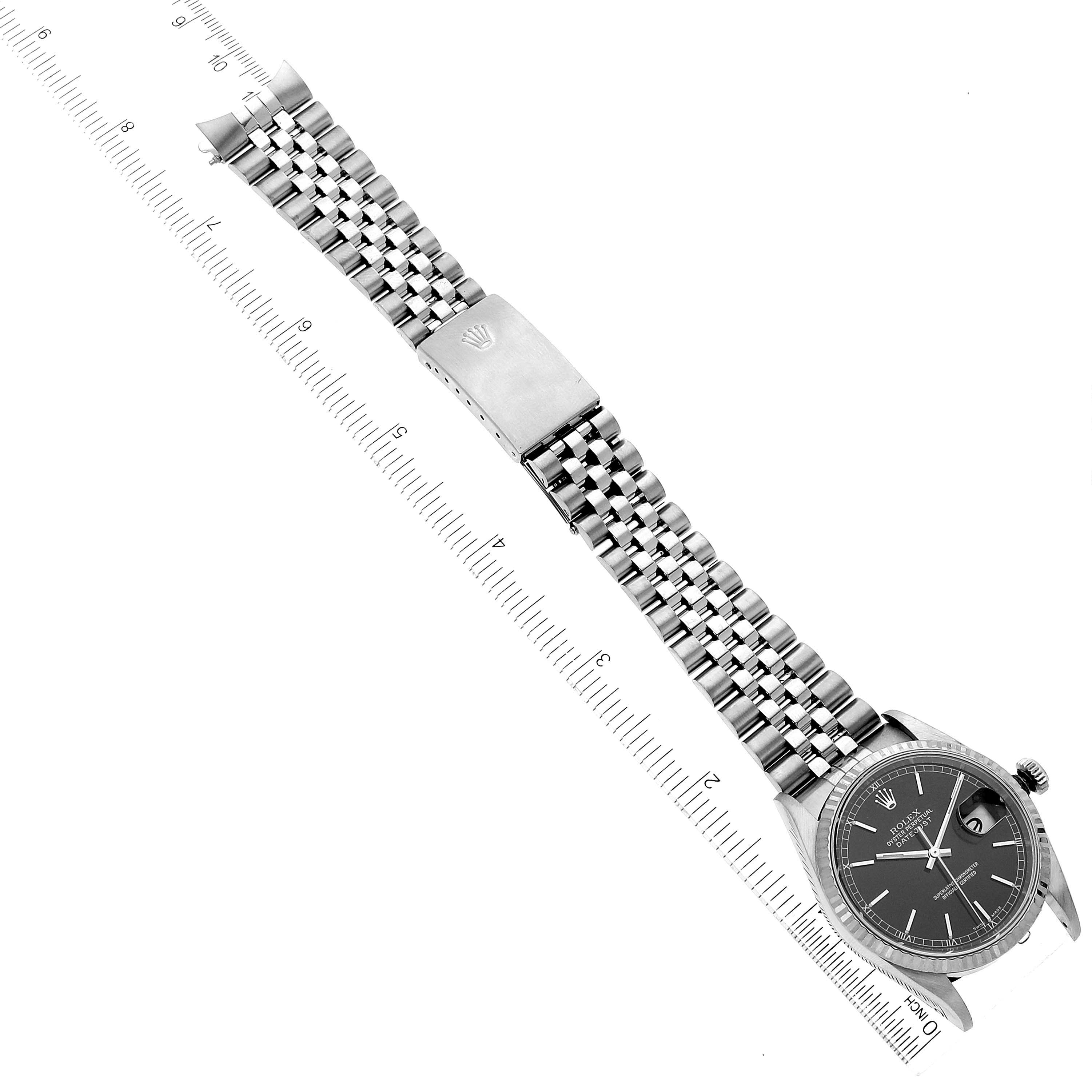 The image shows a top-down view of the Rolex Datejust 16234 Men's Stainless Steel Black Dial 16234 Men's Stainless Steel Black Dial watch, displaying its face and stainless steel bracelet with a clasp.