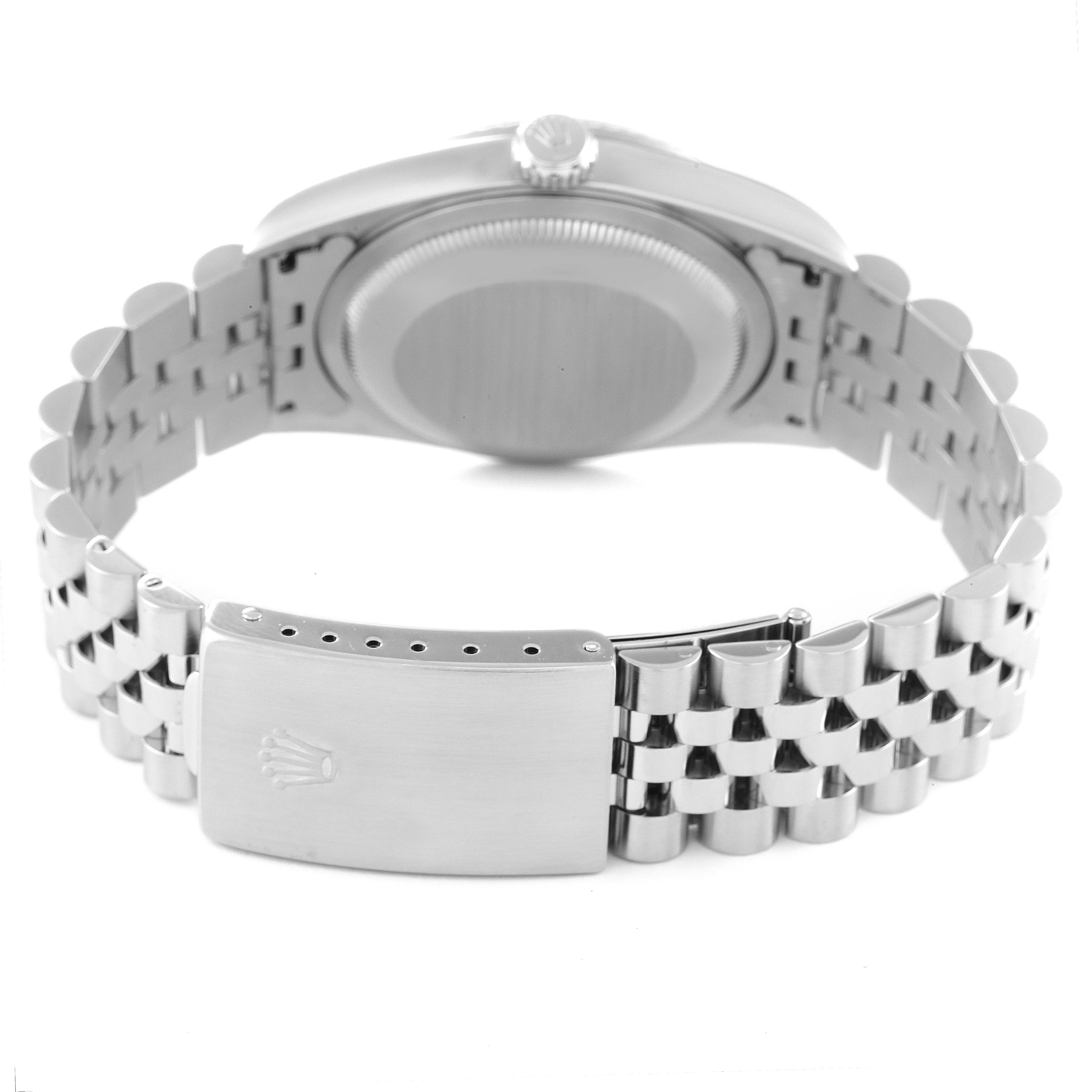 This image shows the clasp and case back of a Rolex Datejust 16234 Men's Stainless Steel Blue Dial 16234 Men's Stainless Steel Blue Dial watch, with a view of the bracelet and crown.